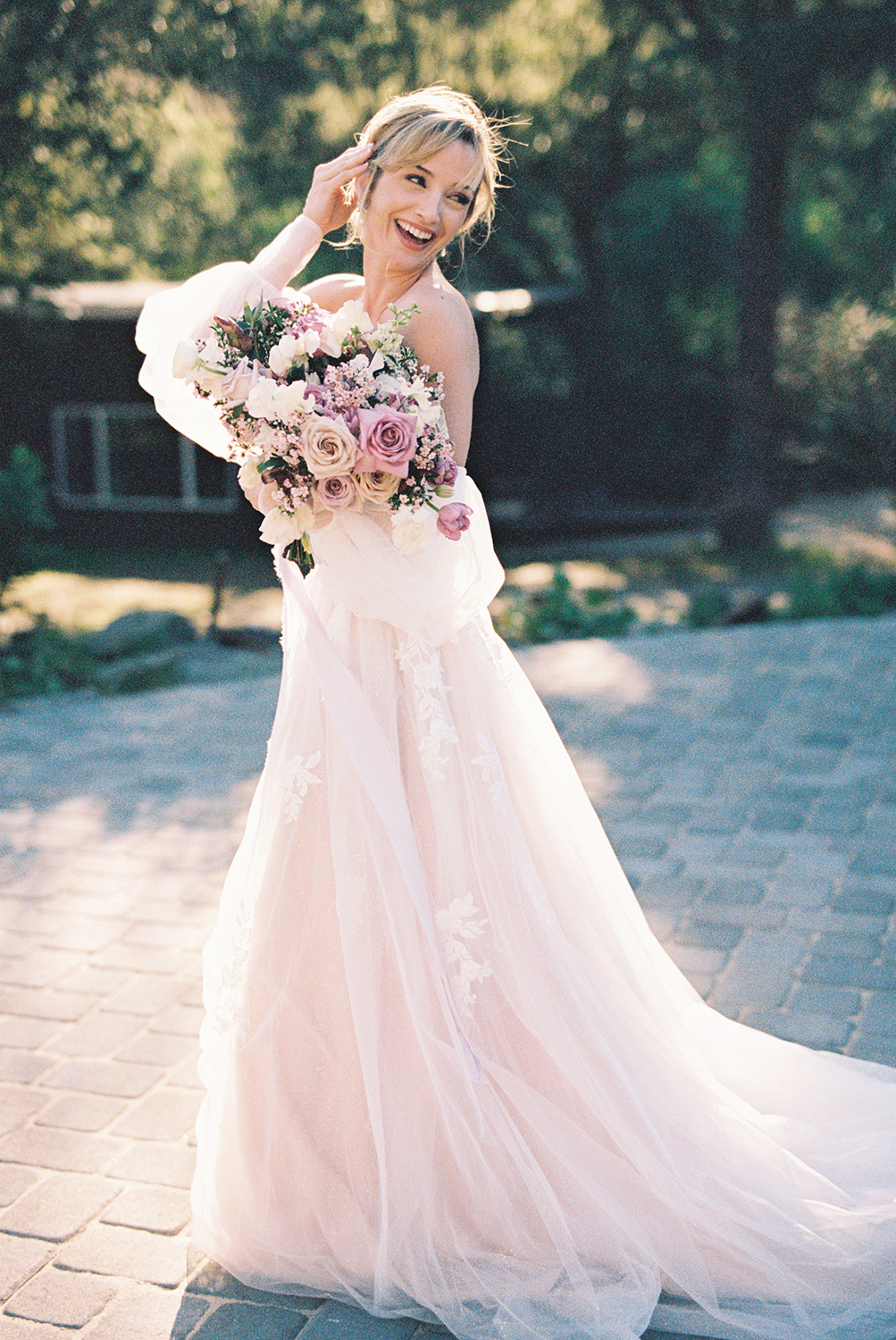 a bride posing for her Elliston Wedding Venue bridal portraits with her bridal bouquet photographed on Kodak Portra 400 Film 