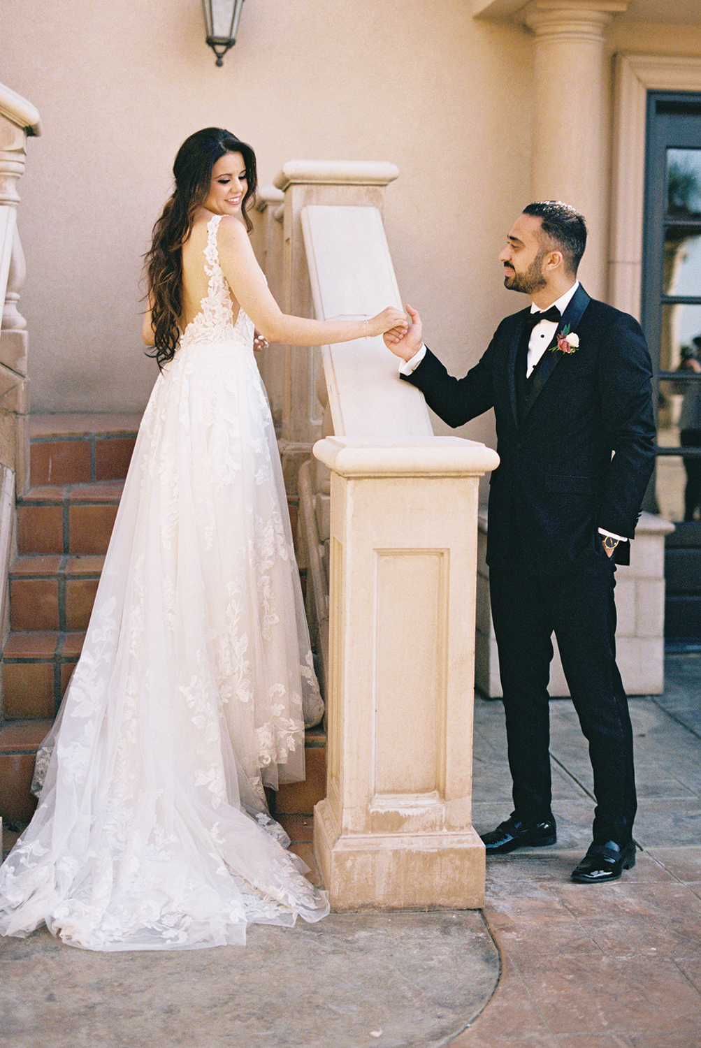 a wedding couple poses for portraits for their grand island mansion wedding photographed on Kodak Portra 400 Film 