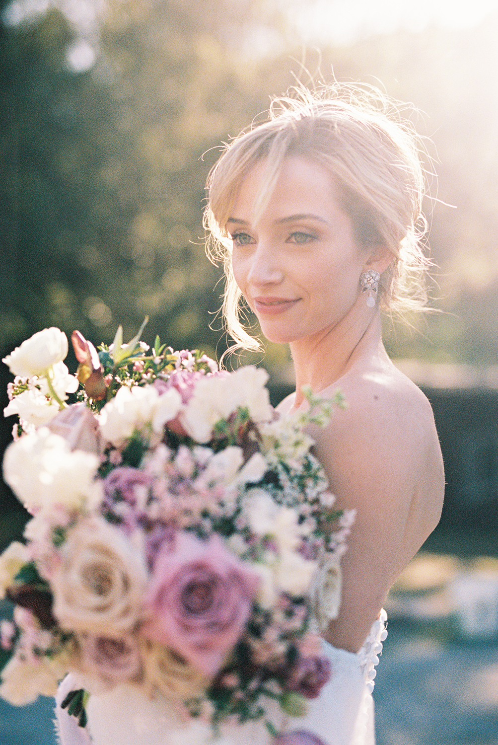 a bride posing for her Elliston Wedding Venue bridal portraits with her bridal bouquet photographed on Kodak Portra 400 Film 