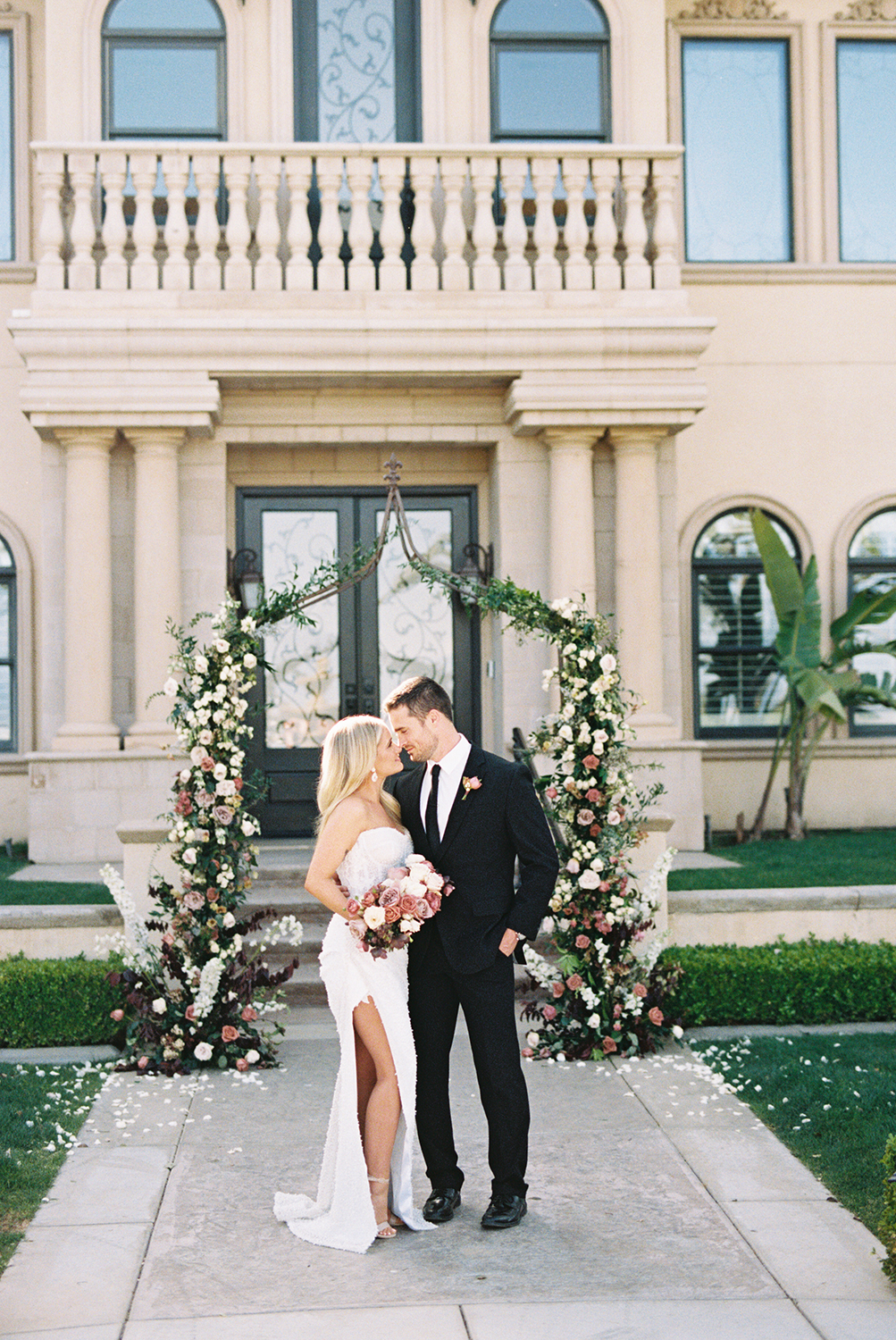 a wedding couple poses for portraits for their grand island mansion wedding photographed on Kodak Portra 400 Film 