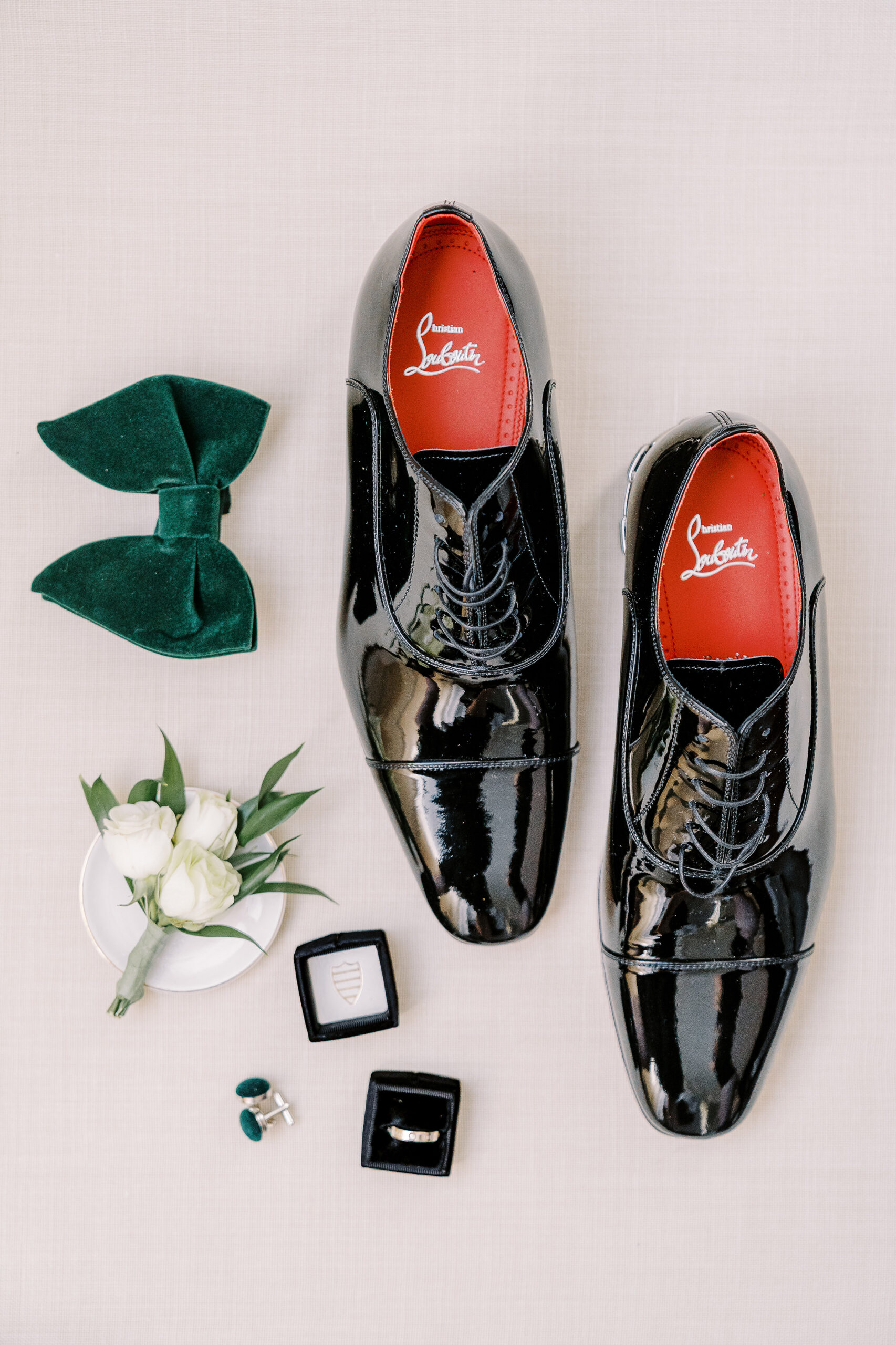 a wedding detail flat lay featuring louboutin shoes for men for a Downtown Sacramento Vizcaya Wedding