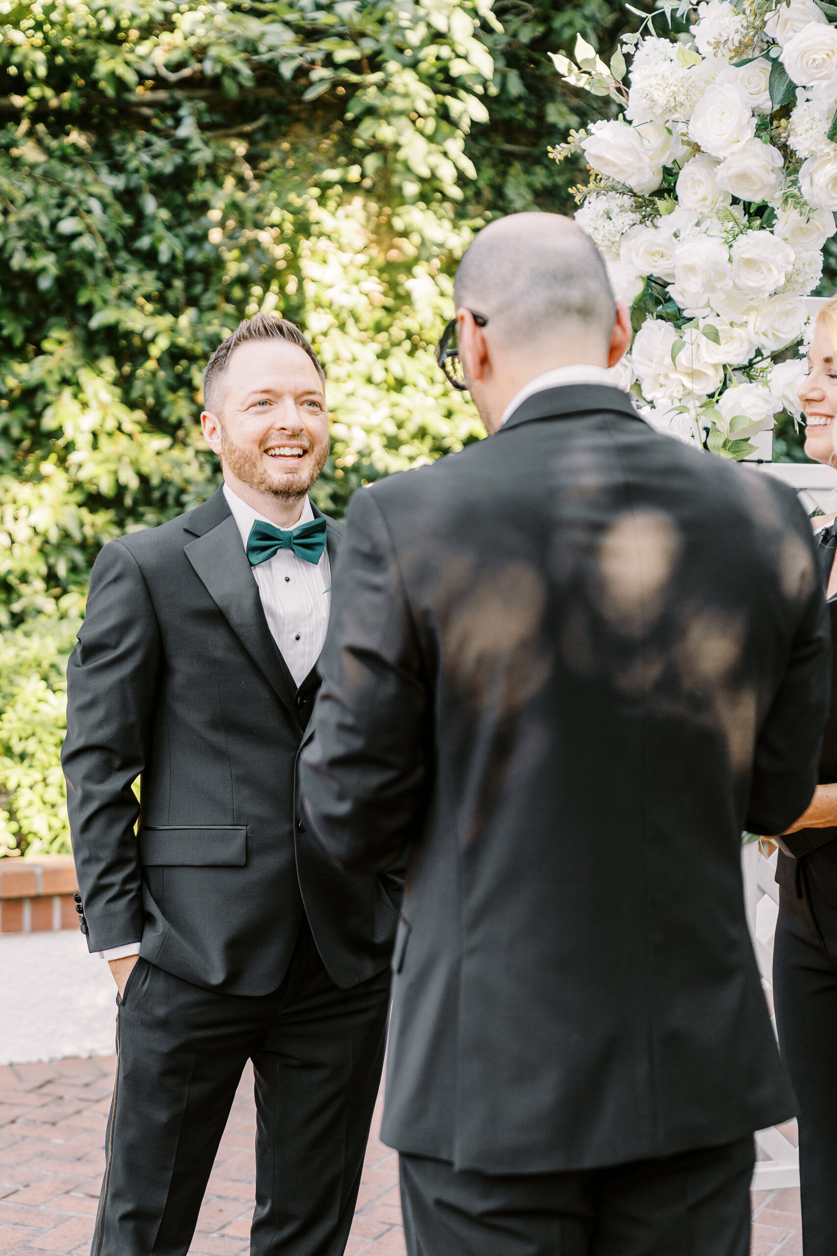two grooms read their vows to each other during their wedding ceremony at their Downtown Sacramento Vizcaya Wedding 
