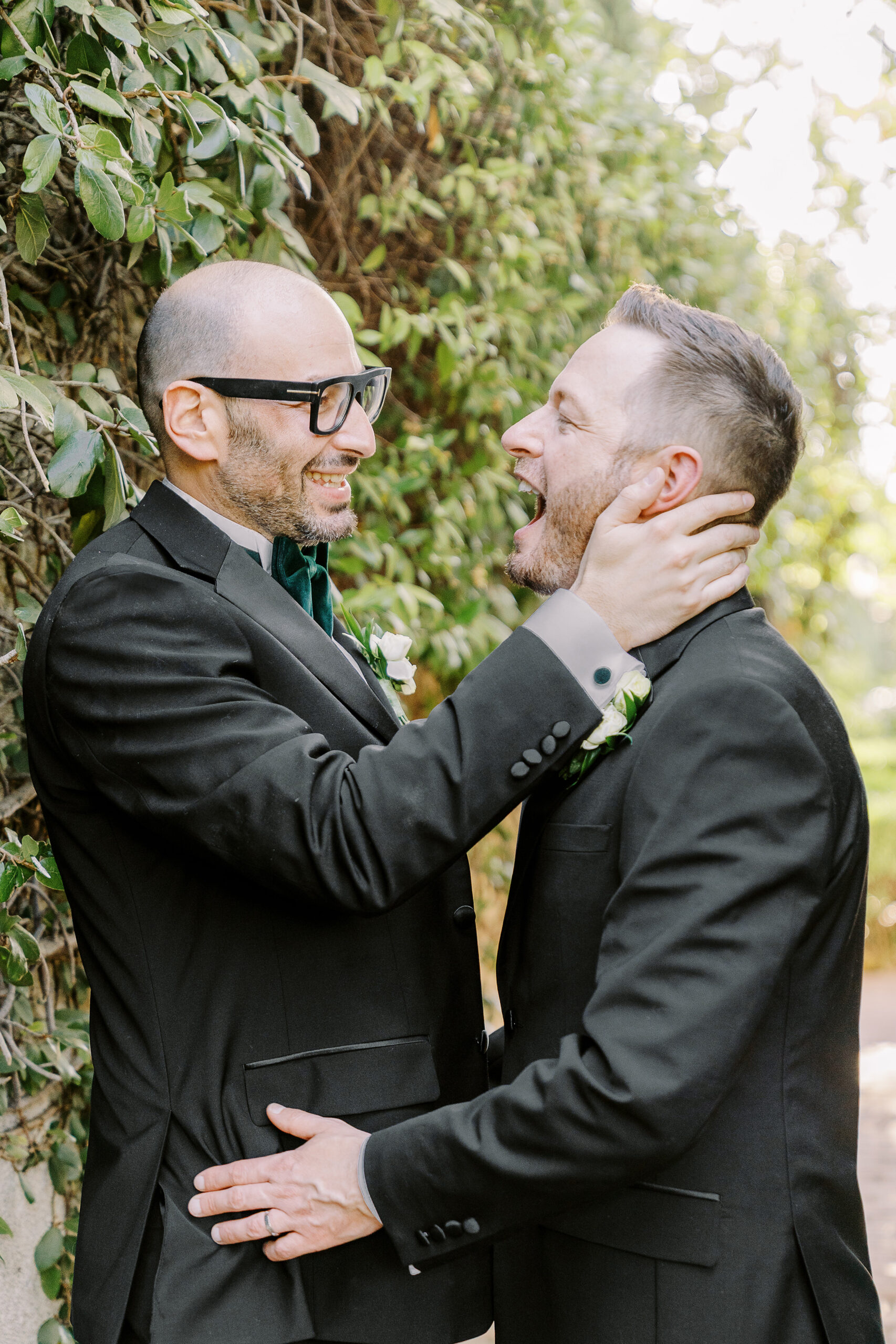 two grooms share a laugh at their Downtown Sacramento Vizcaya Wedding 