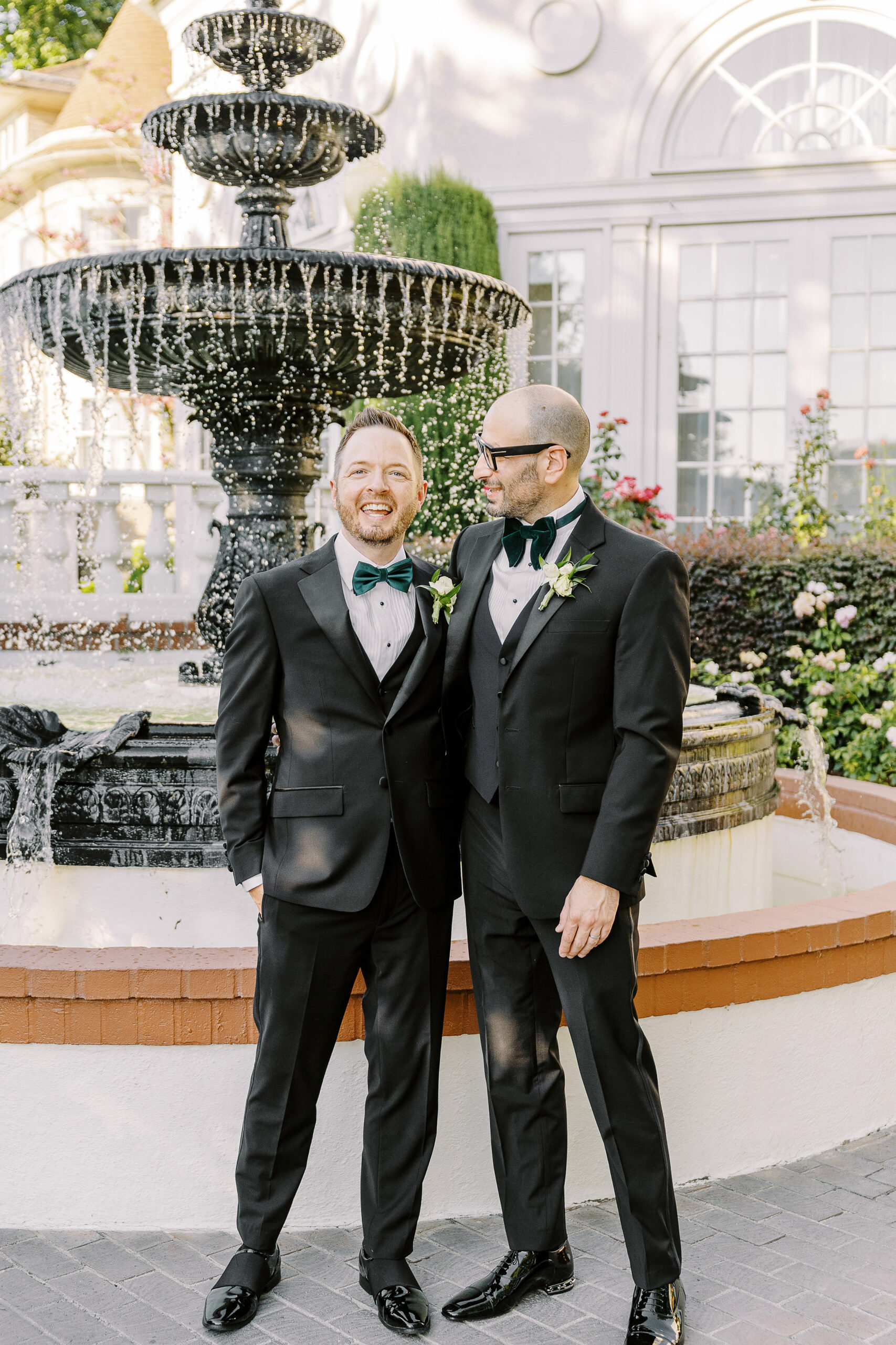 two grooms embrace each other at their Downtown Sacramento Vizcaya Wedding 