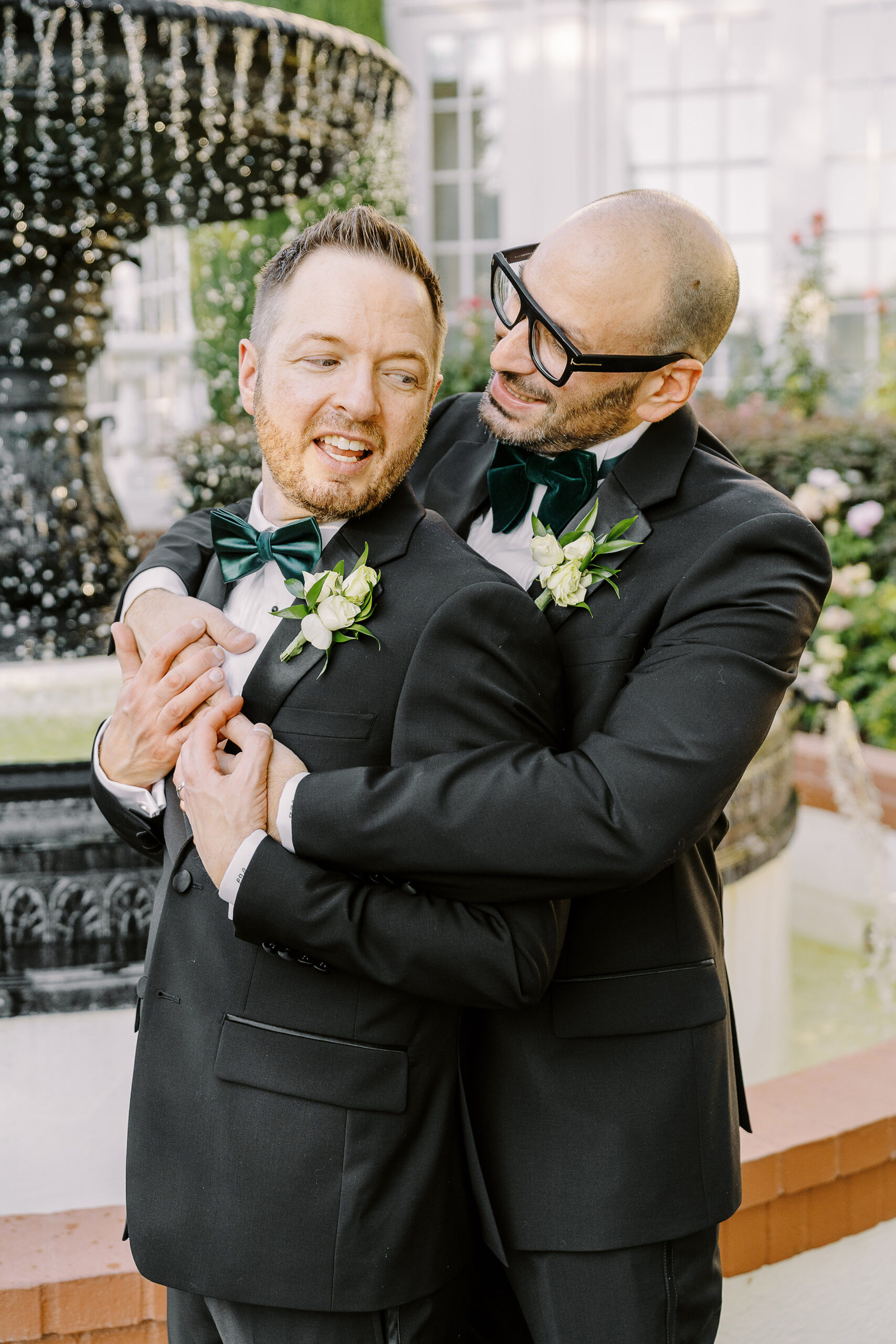 two grooms embrace each other at their Downtown Sacramento Vizcaya Wedding 