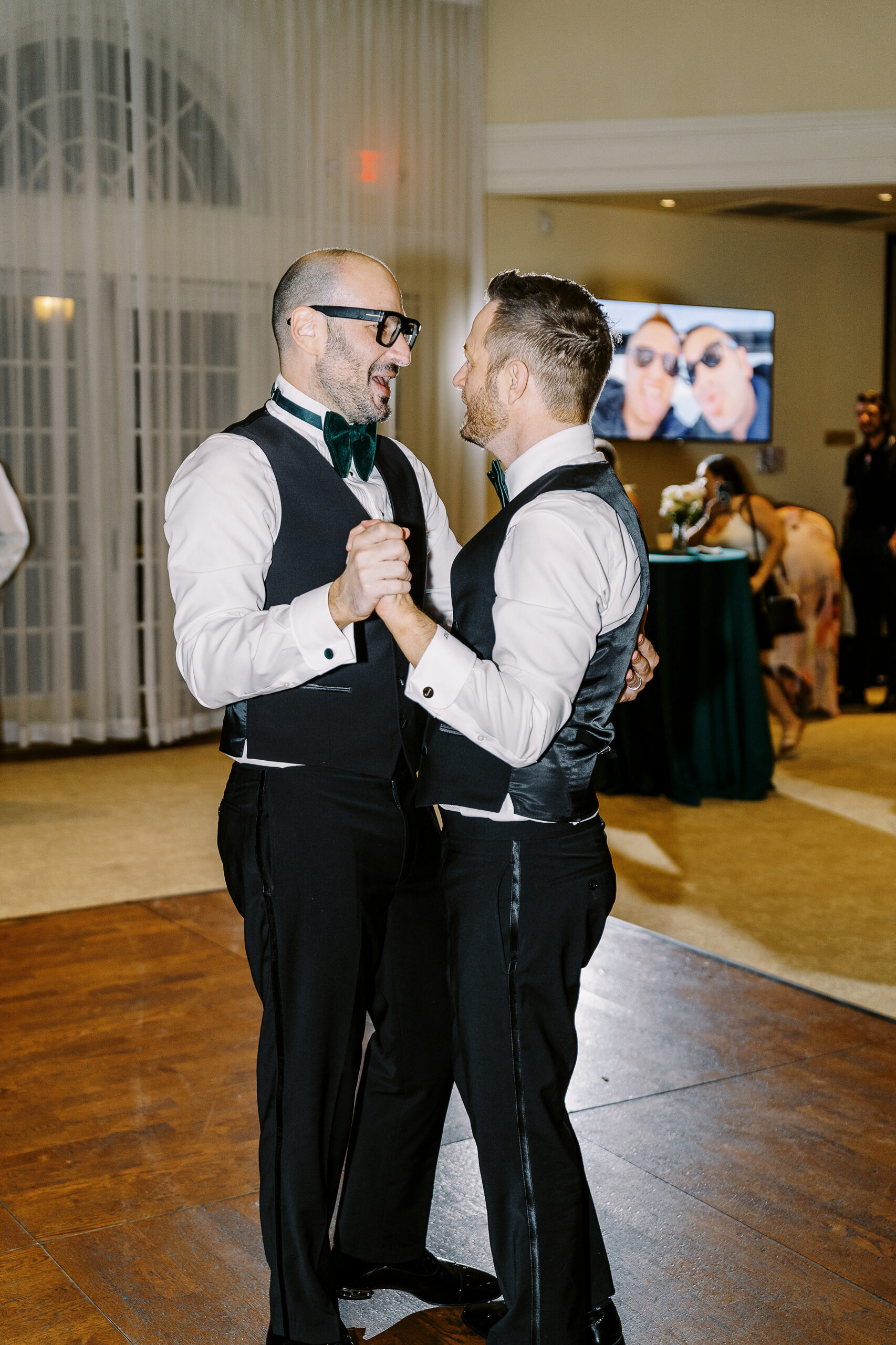 two grooms share their first dance at their Downtown Sacramento Vizcaya Wedding 