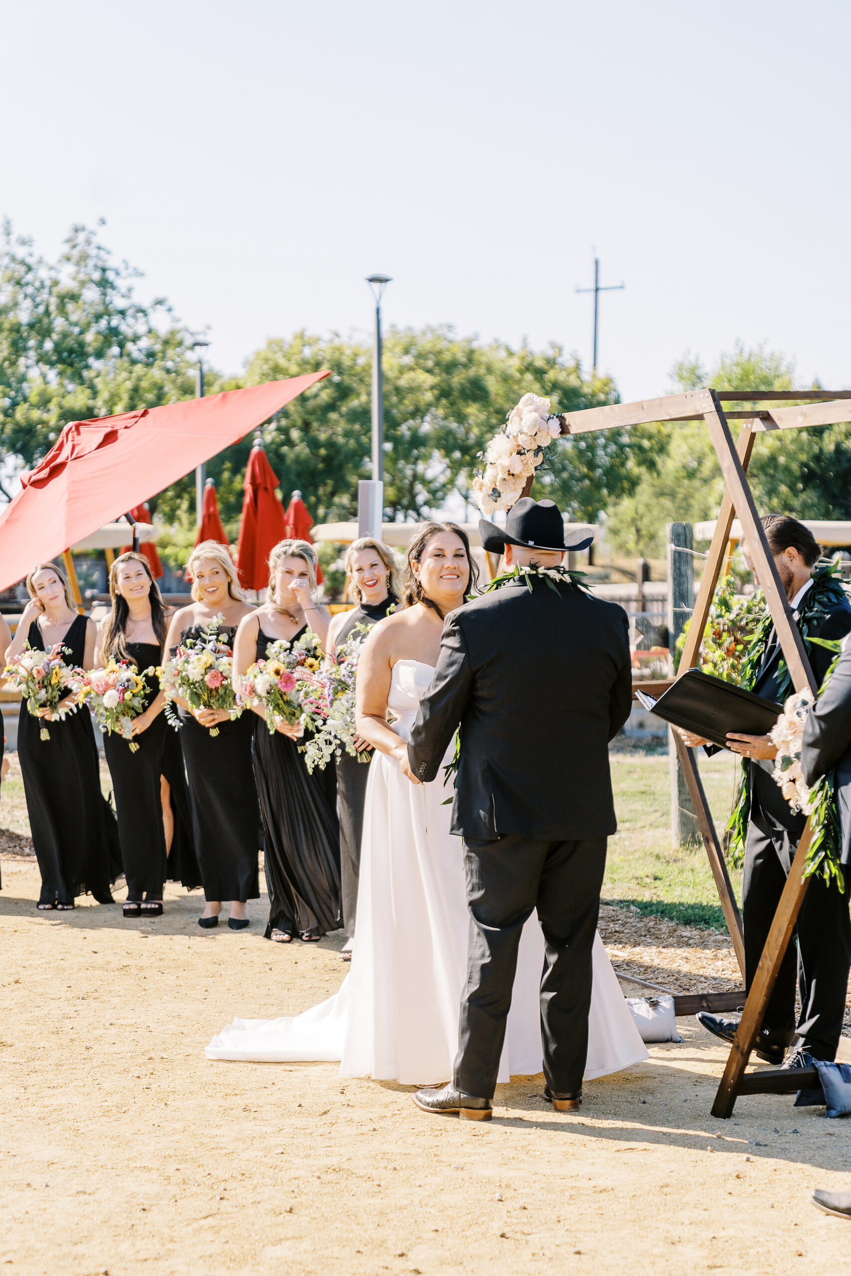 a bride and groom share a laugh during their wedding ceremony during their sonoma winery wedding.