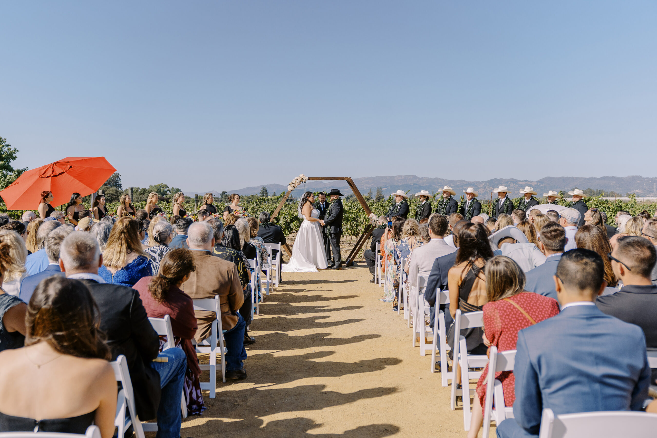 a bride and groom share a laugh during their wedding ceremony during their sonoma winery wedding.