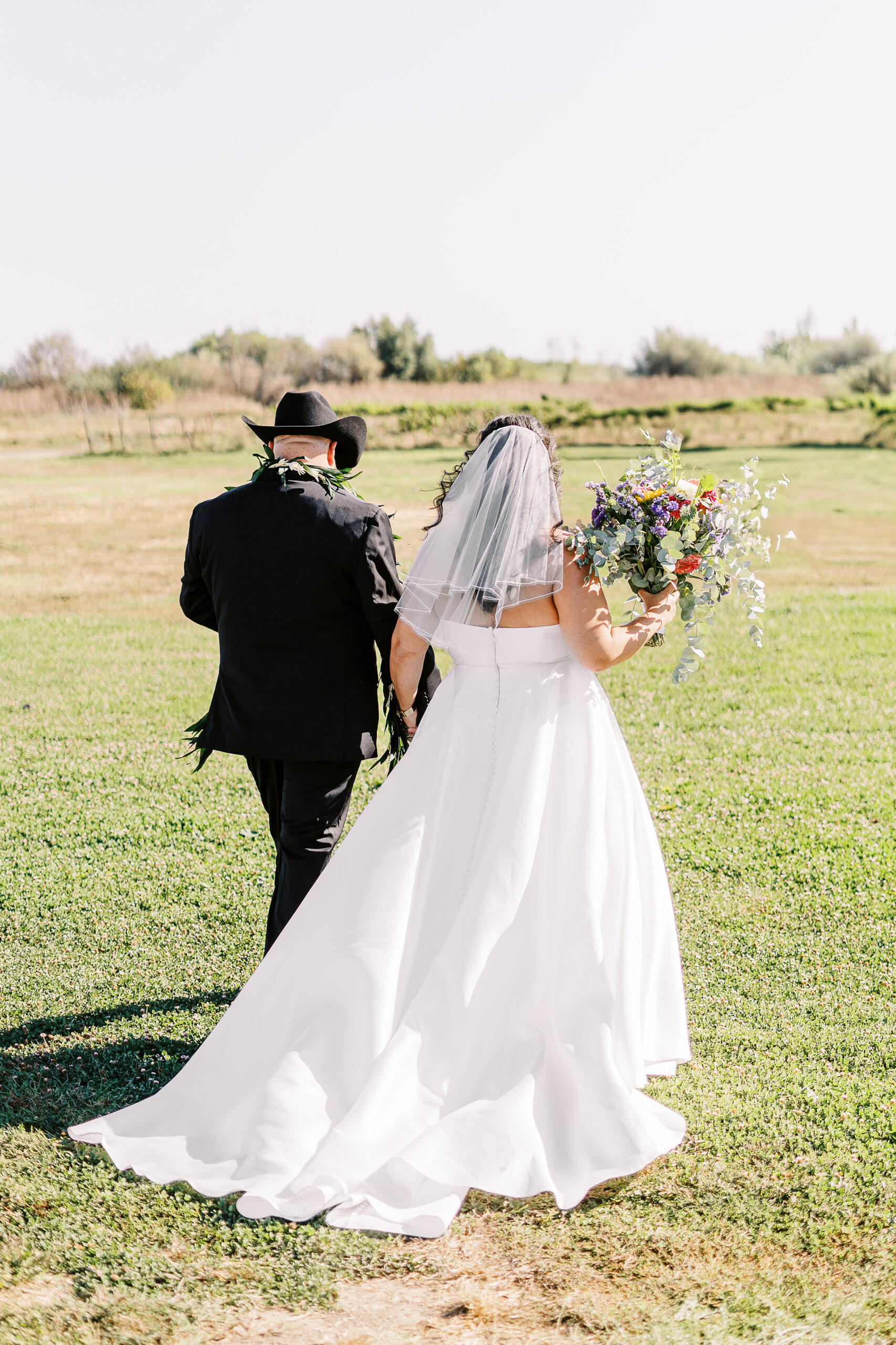 a bride and groom celebrate being newlyweds