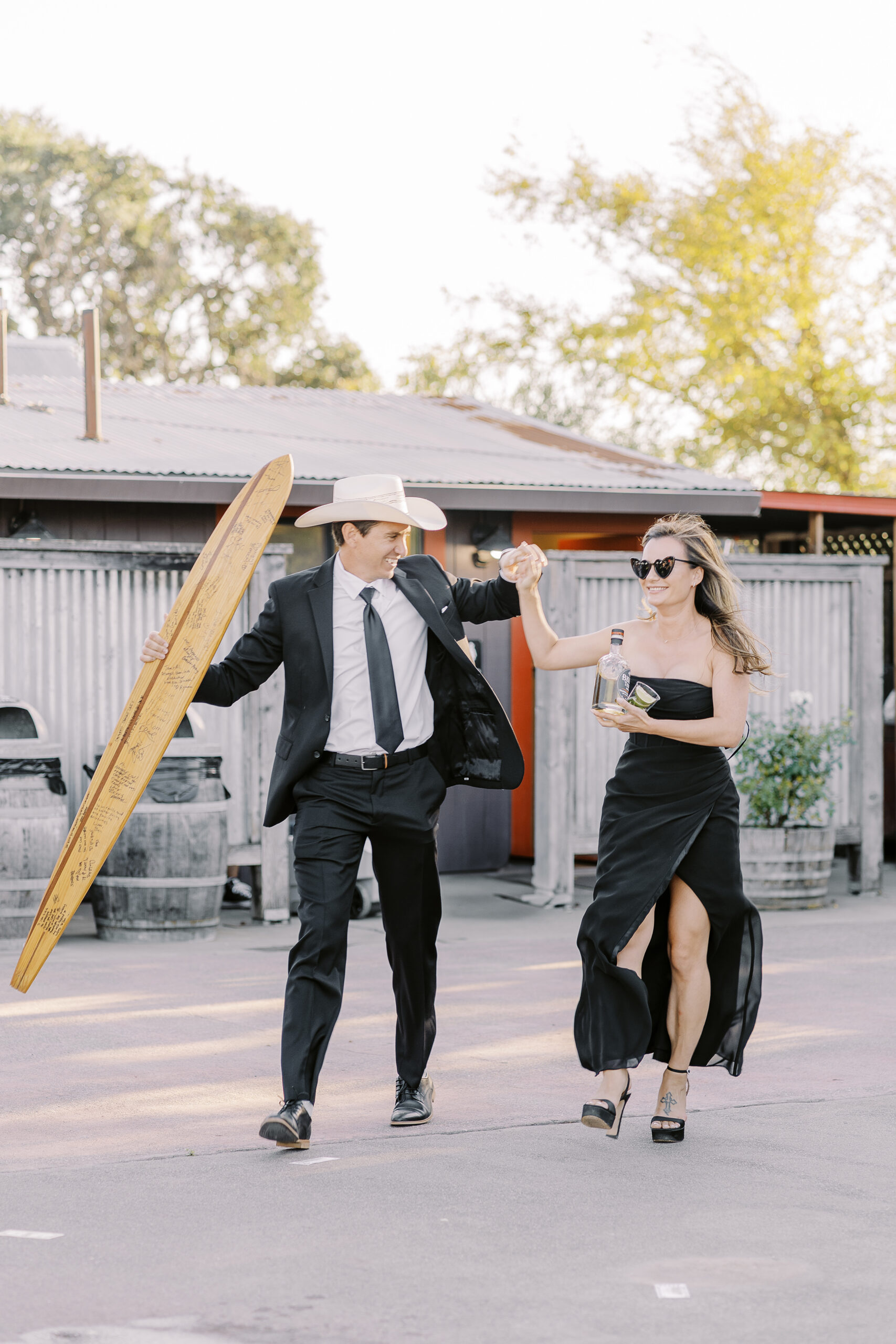 a rowdy wedding party makes their entrances to a reception at a sonoma winery wedding.