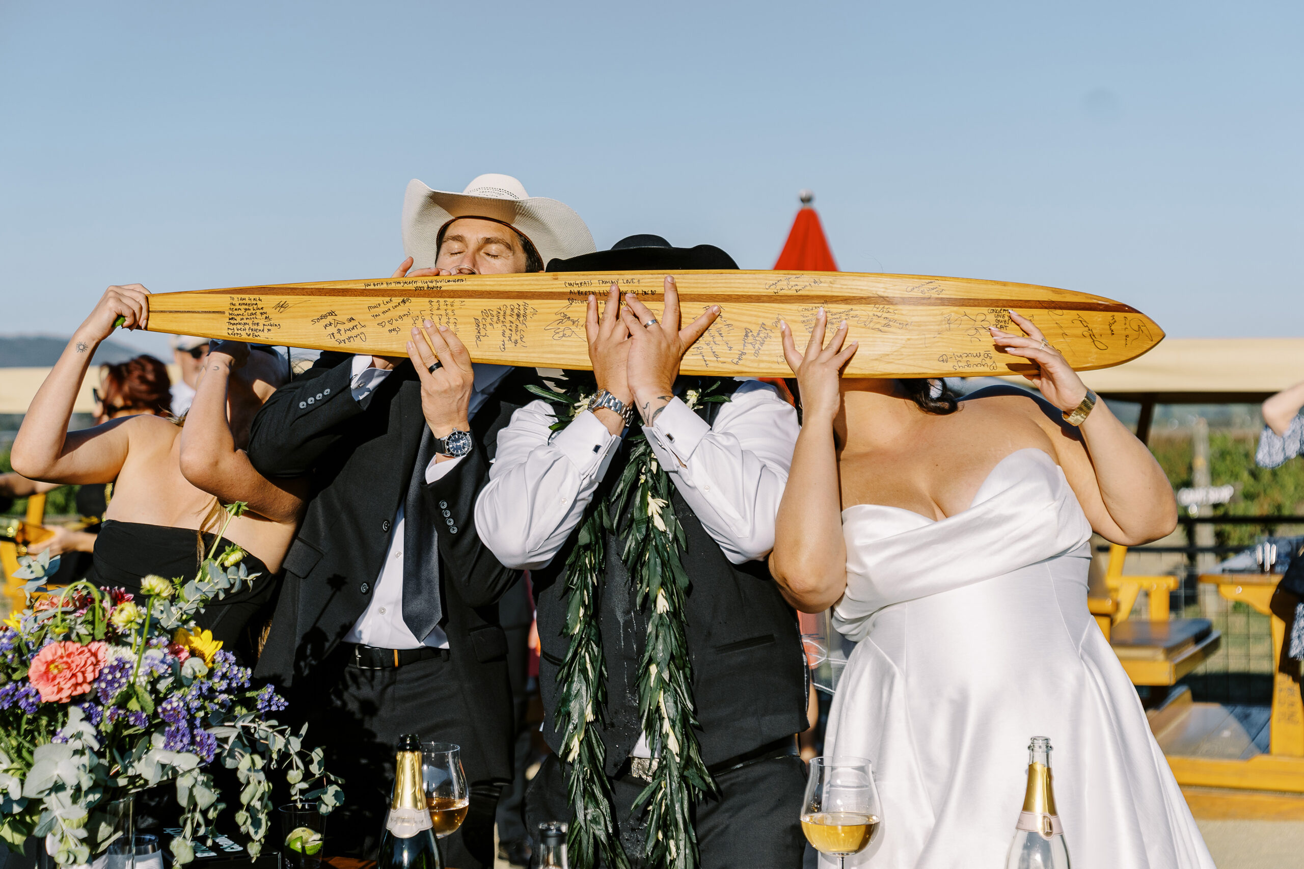 a rowdy wedding party makes their entrances to a reception at a sonoma winery wedding.