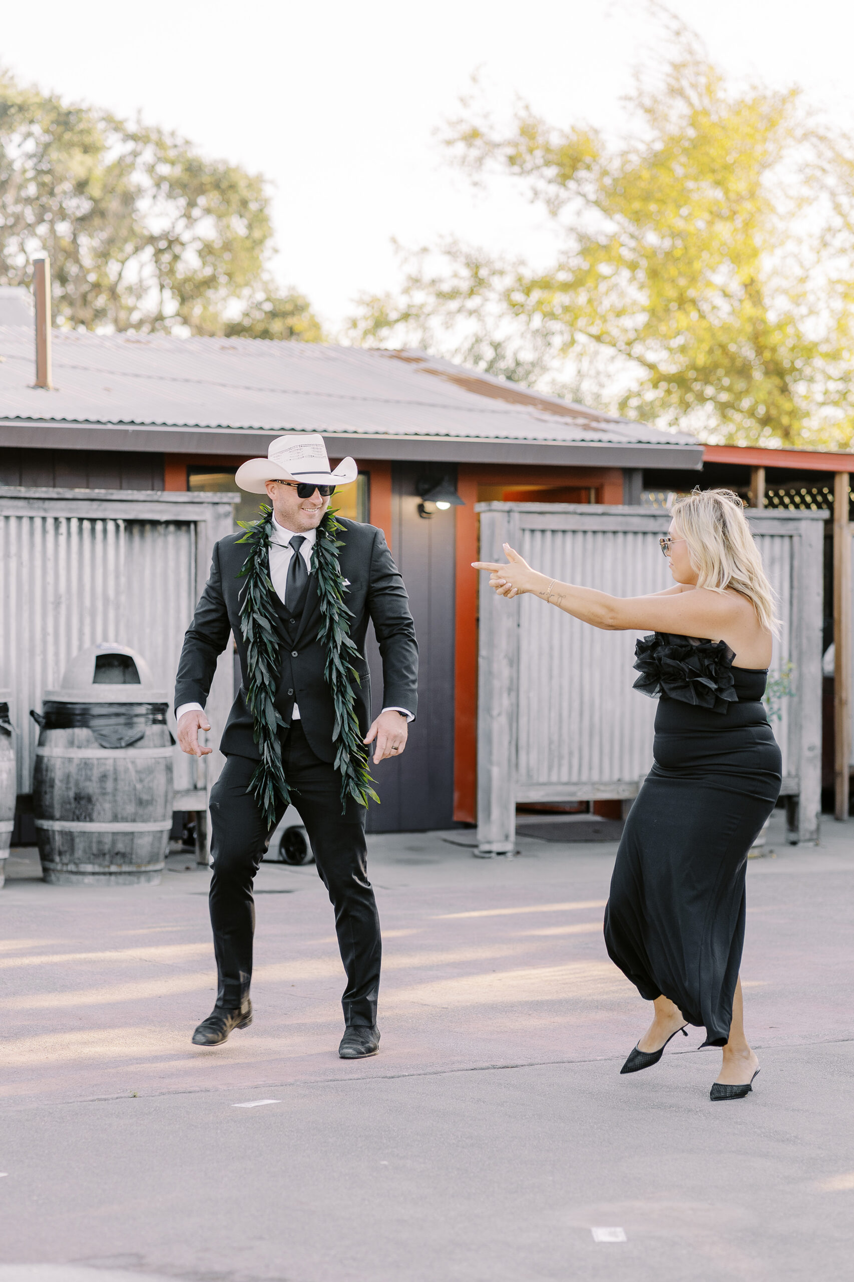 a rowdy wedding party makes their entrances to a reception at a sonoma winery wedding.