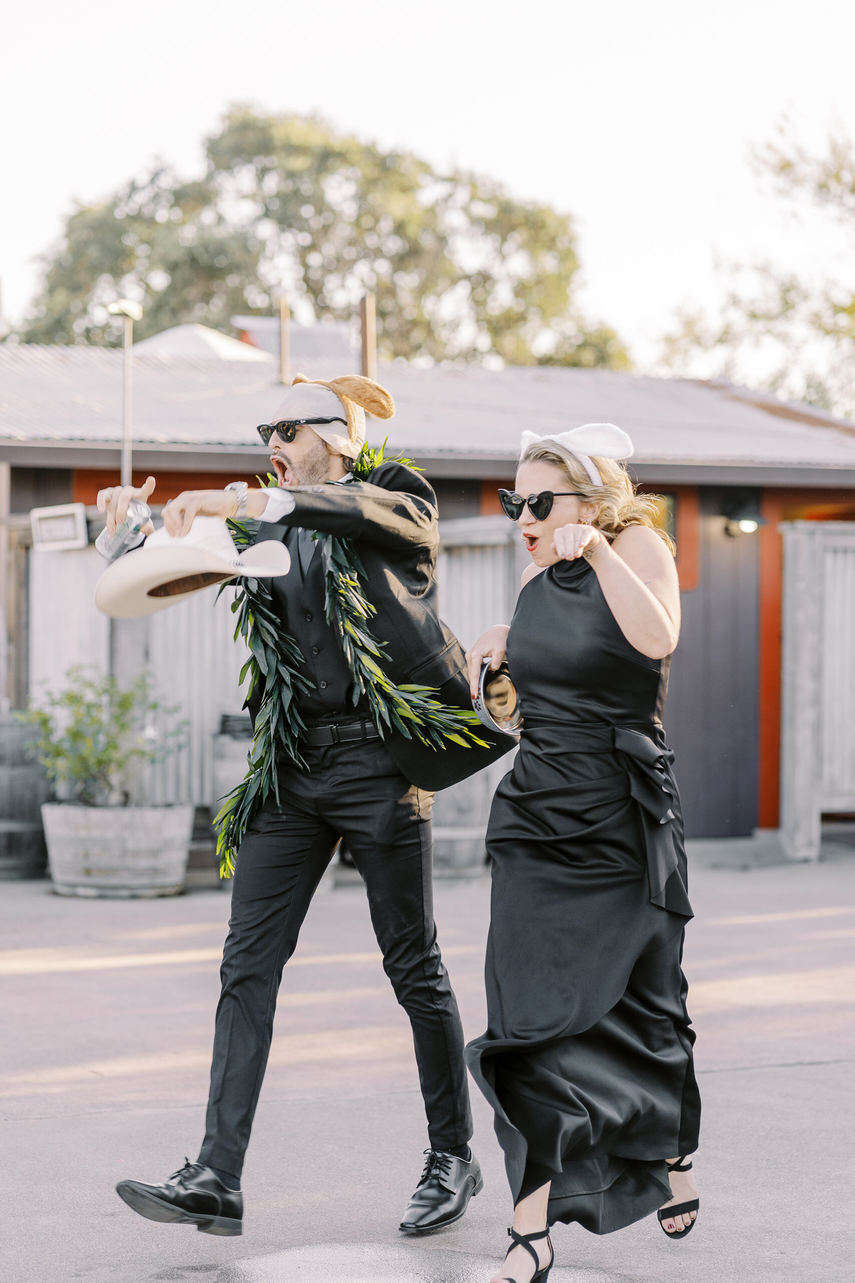 a rowdy wedding party makes their entrances to a reception at a sonoma winery wedding.
