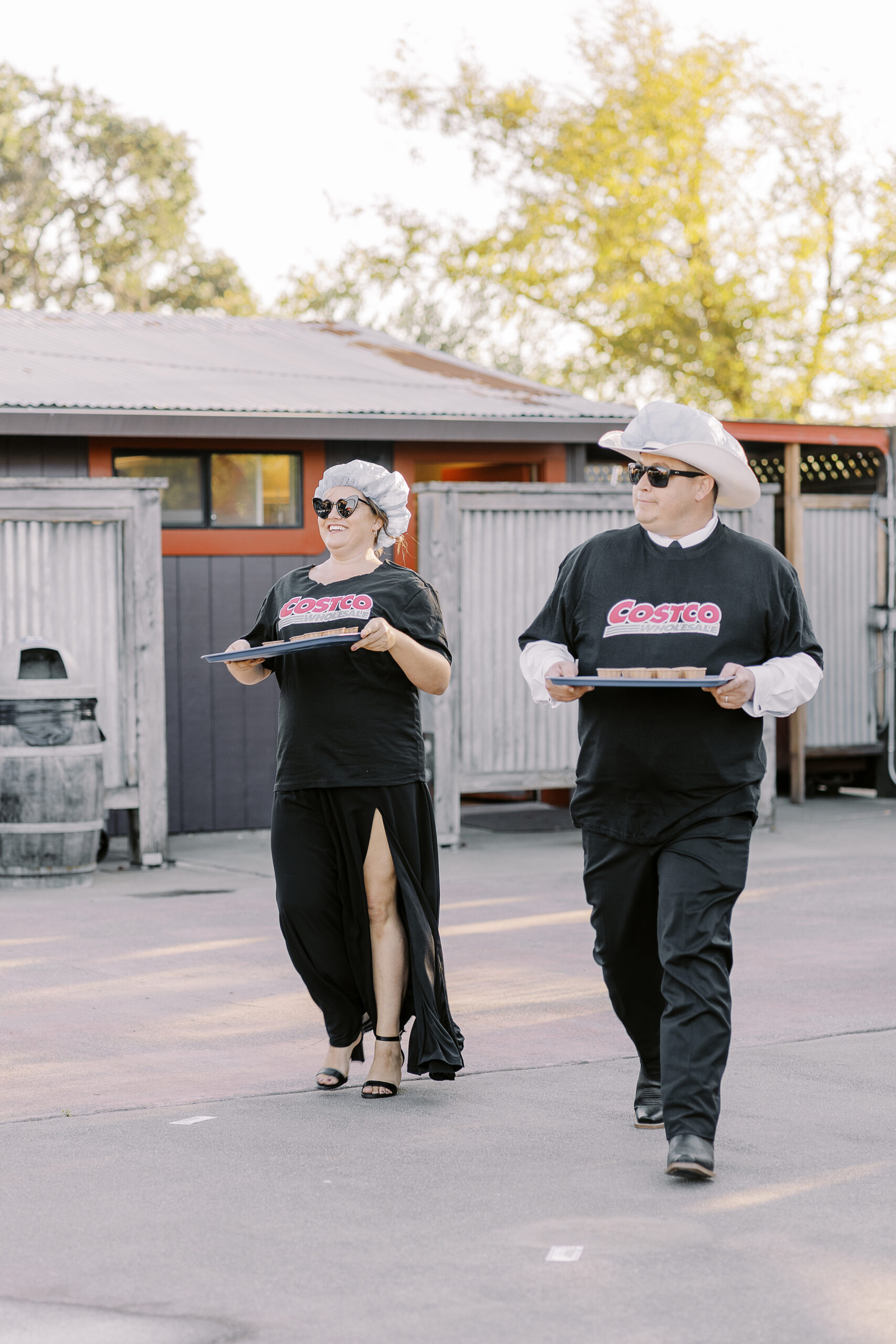 a rowdy wedding party makes their entrances to a reception at a sonoma winery wedding.