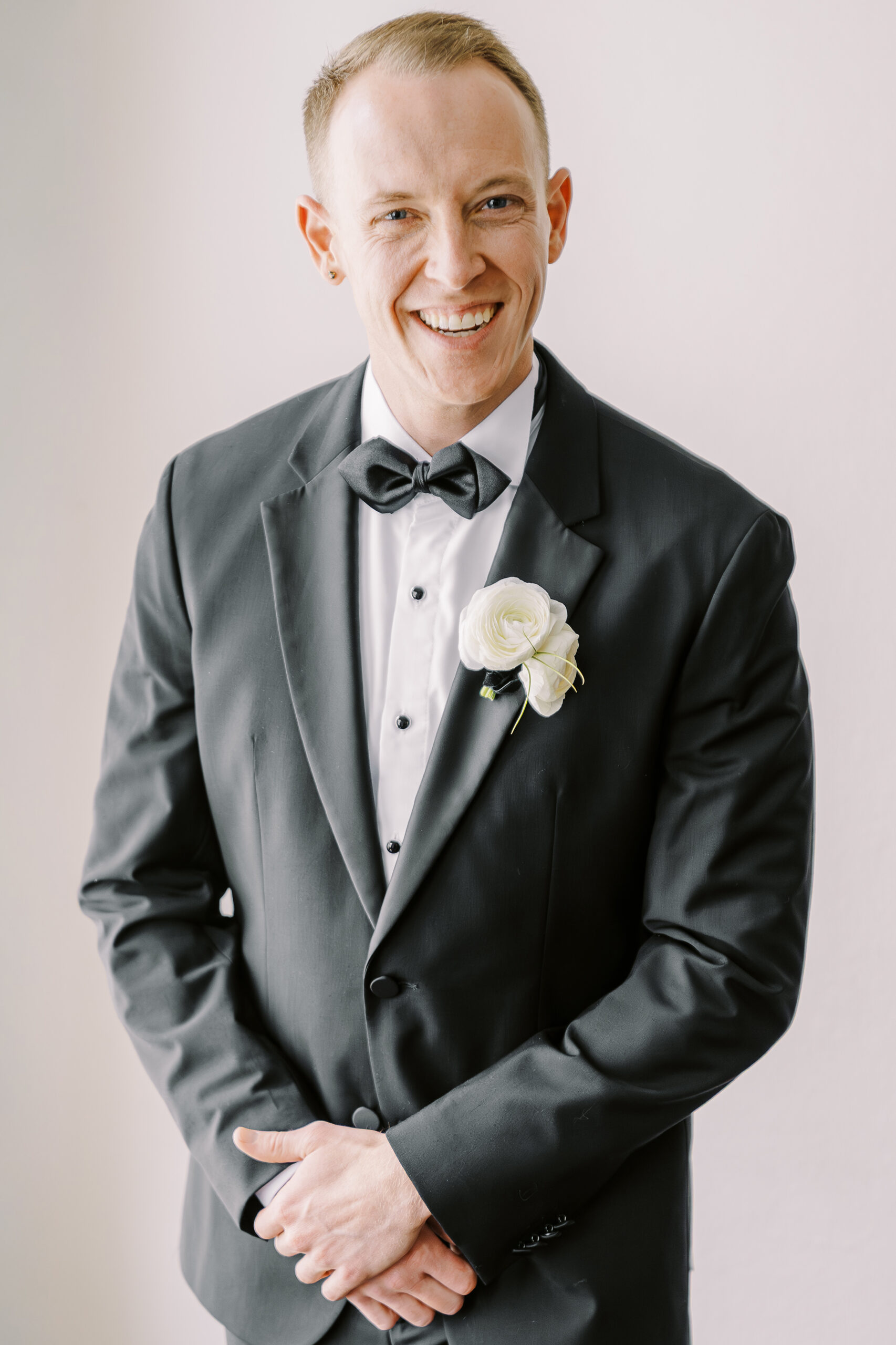 a groom smiles at the camera at his vizcaya sacramento wedding