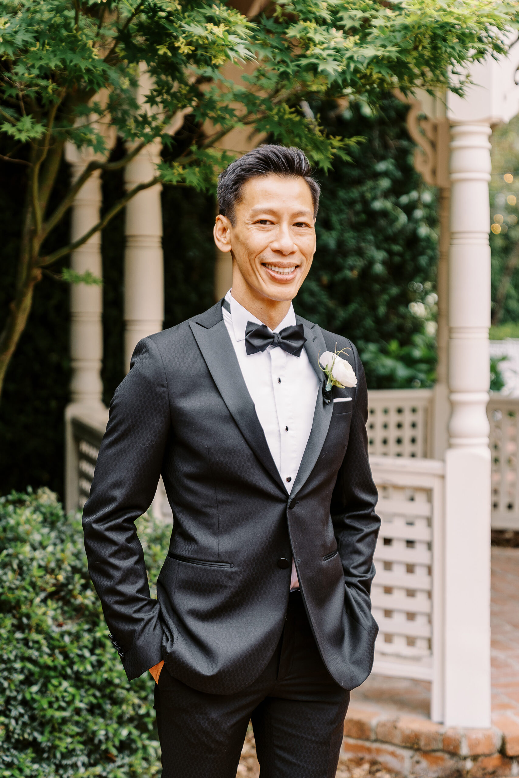 a groom smiles at the camera during his vizcaya wedding