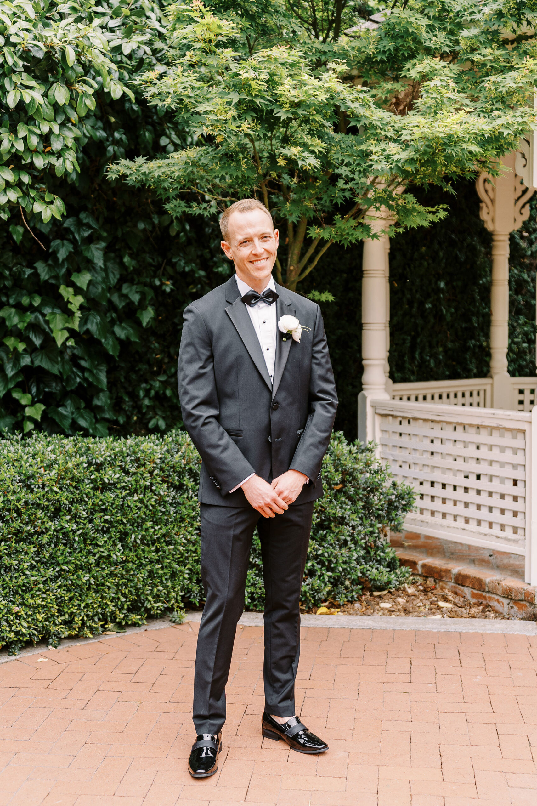 a groom smiles at the camera during his vizcaya wedding