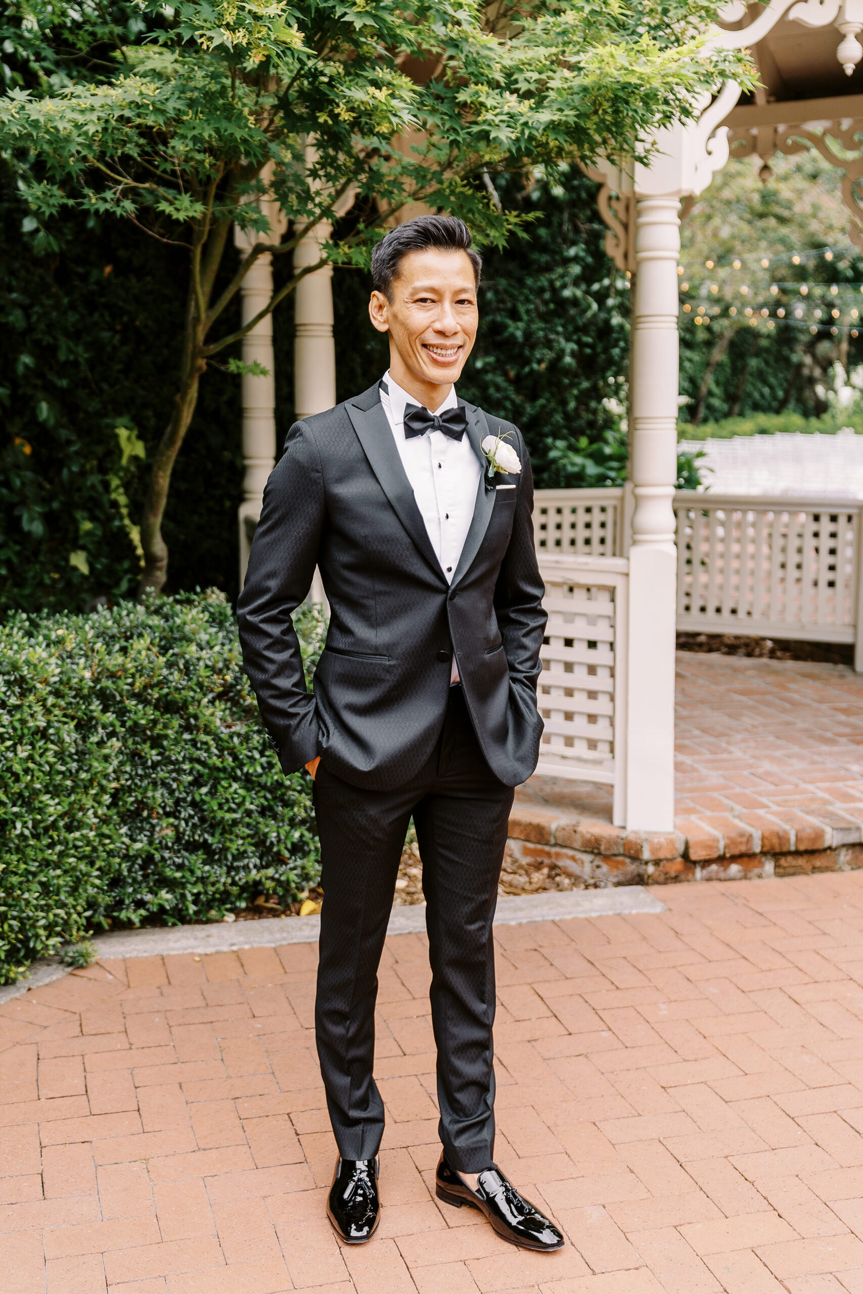 a groom smiles at the camera during his vizcaya wedding