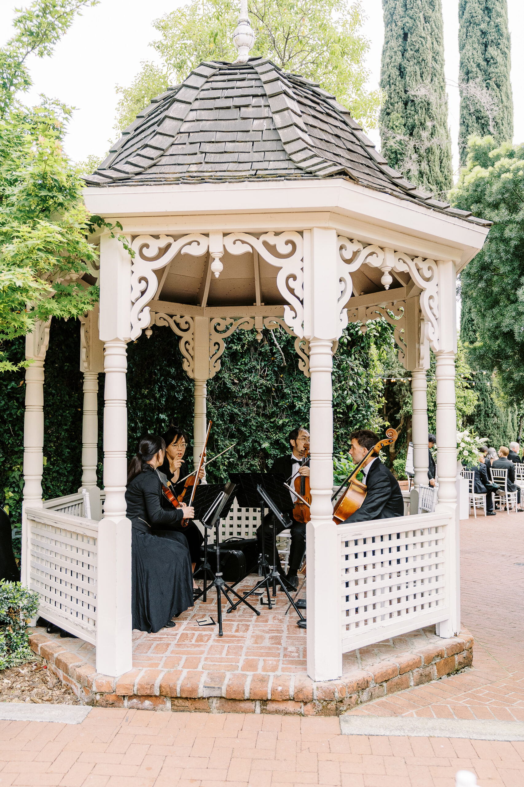 a string quartet plays for a wedding ceremony at the vizcaya sacramento wedding venue