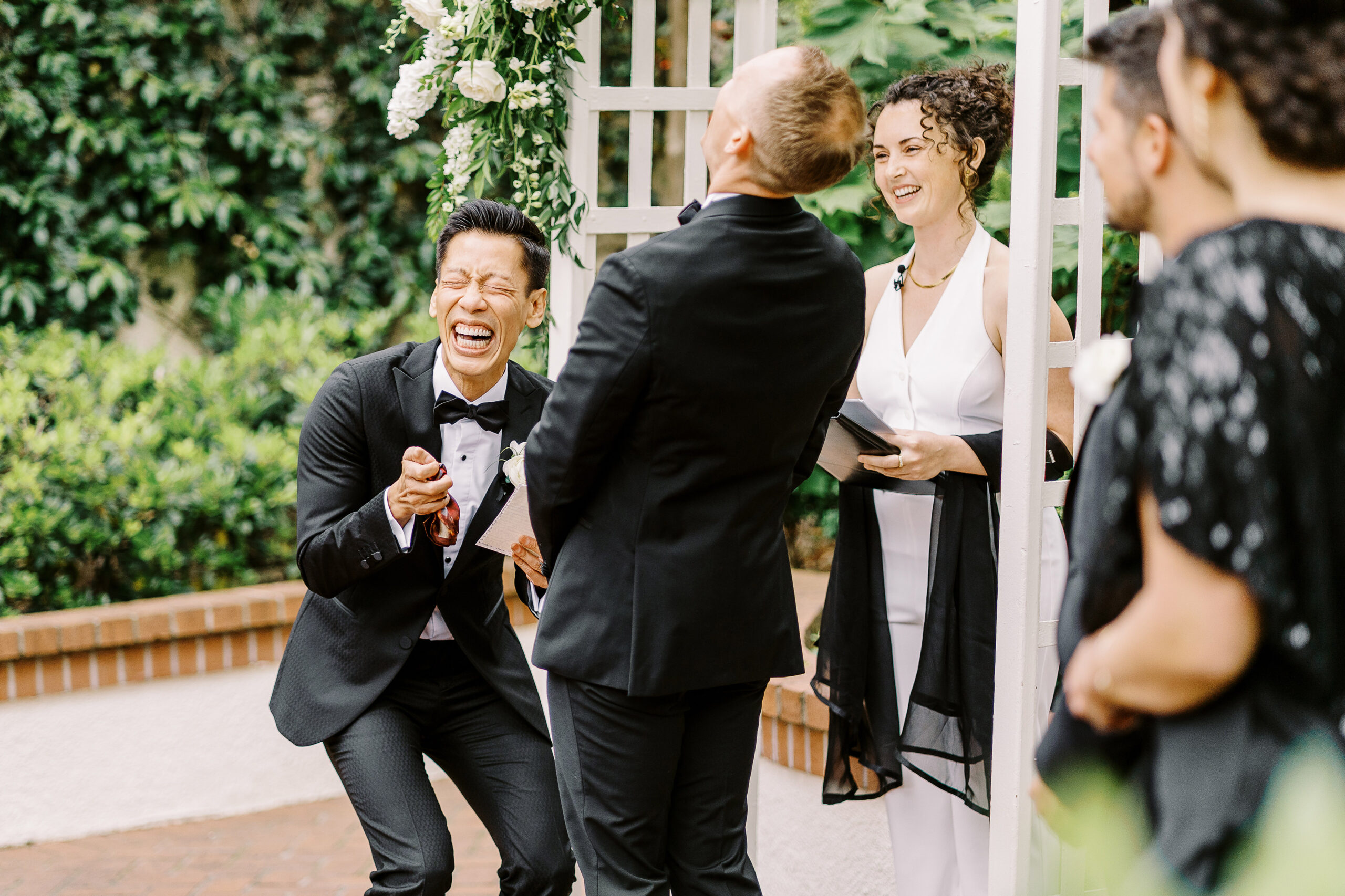 two grooms laugh at their lgbtq vizcaya sacramento wedding ceremony