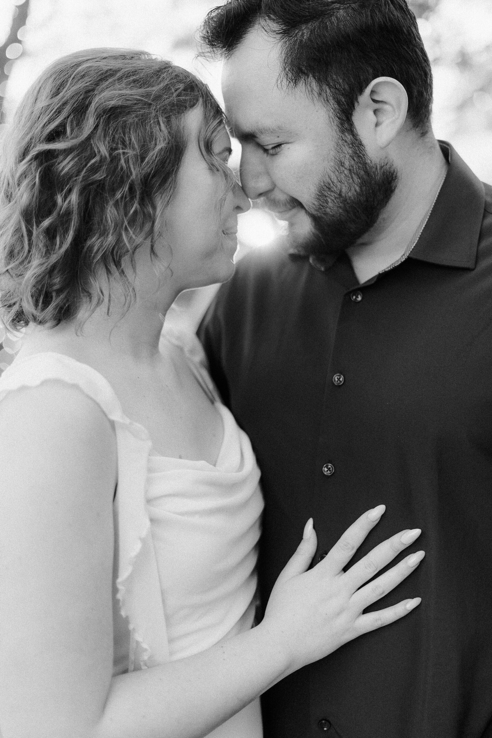 a couple nuzzling noses during their sacramento wolfe heights winery engagement photos
