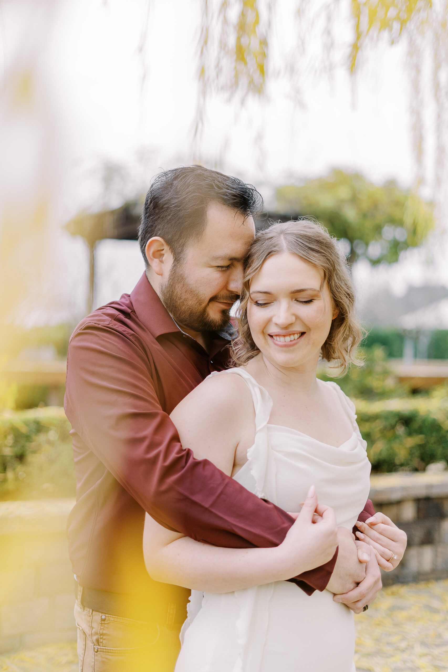 a couple shares a snuggle during their sacramento wolfe heights winery engagement photos