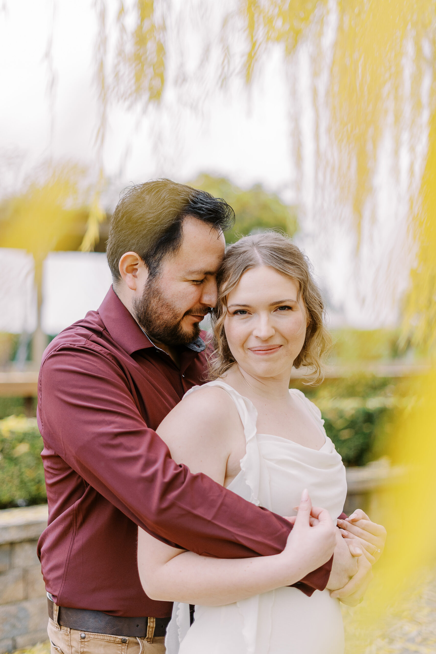 a couple shares a snuggle during their sacramento wolfe heights winery engagement photos