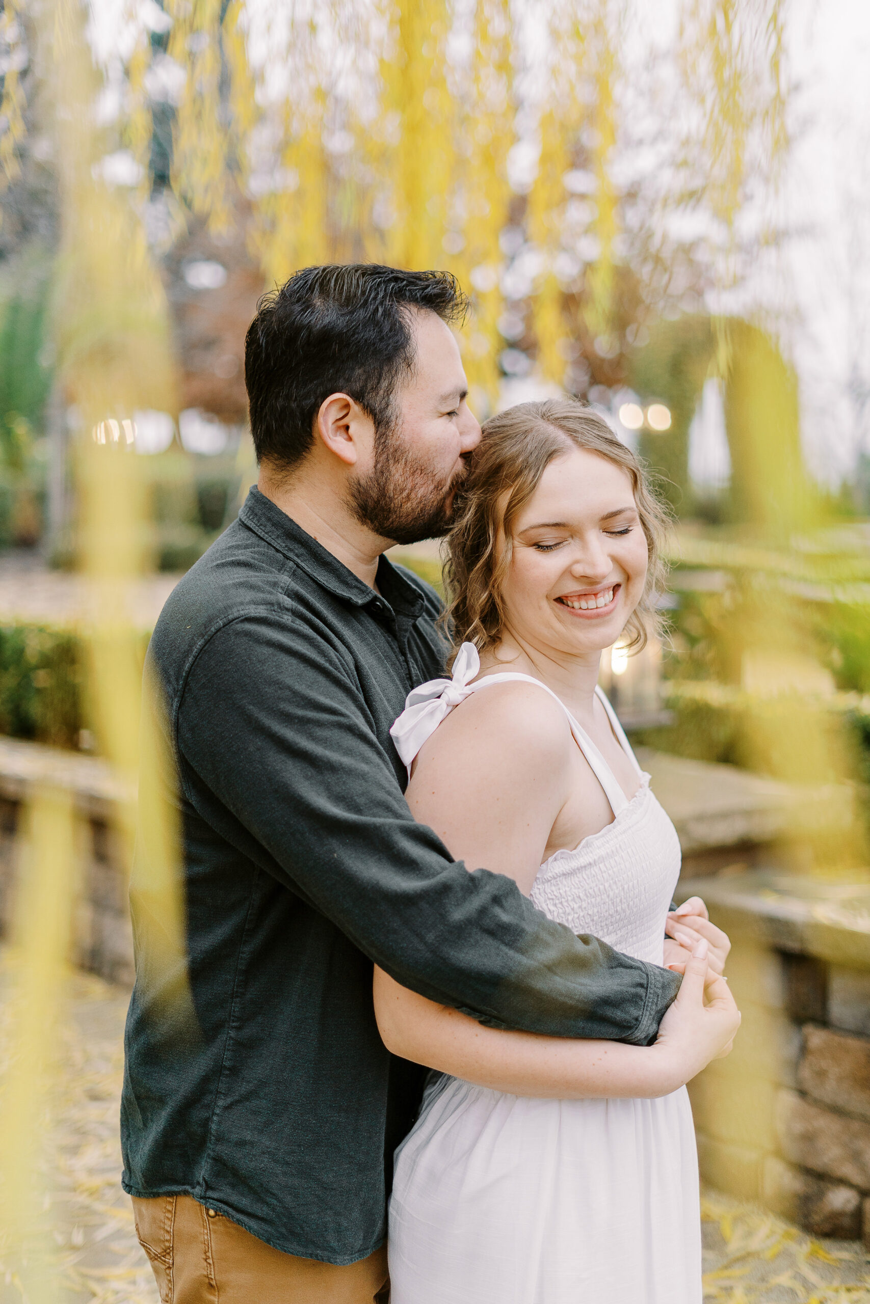 a couple shares a snuggle during their sacramento wolfe heights winery engagement photos