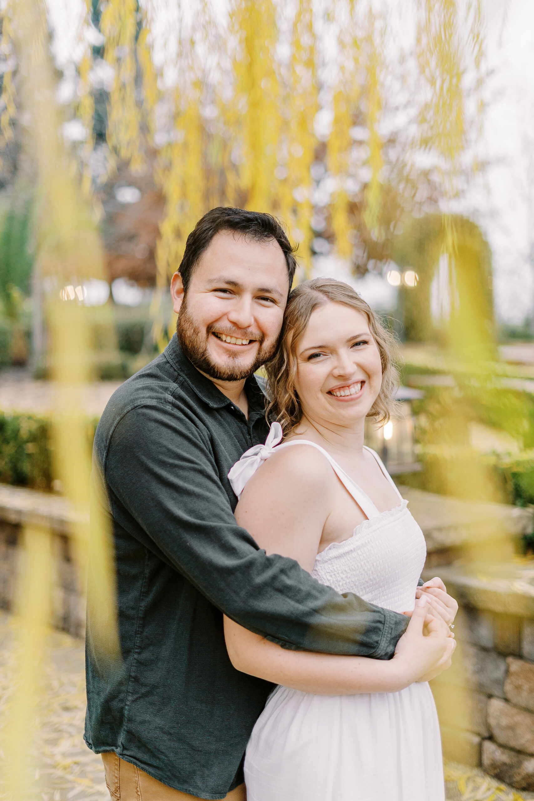a couple shares a snuggle during their sacramento wolfe heights winery engagement photos