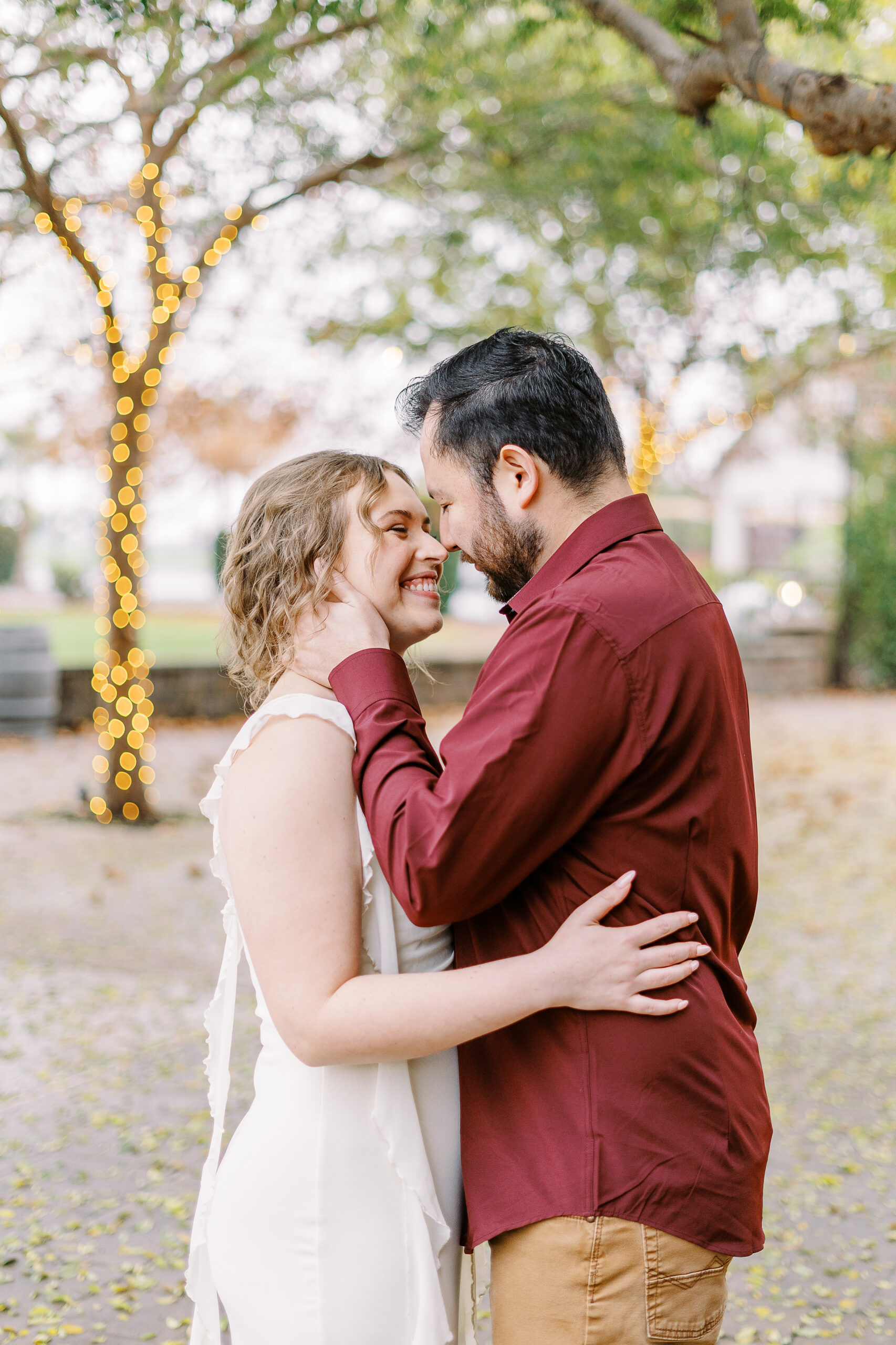a couple nuzzles noses during their sacramento wolfe heights winery engagement photos