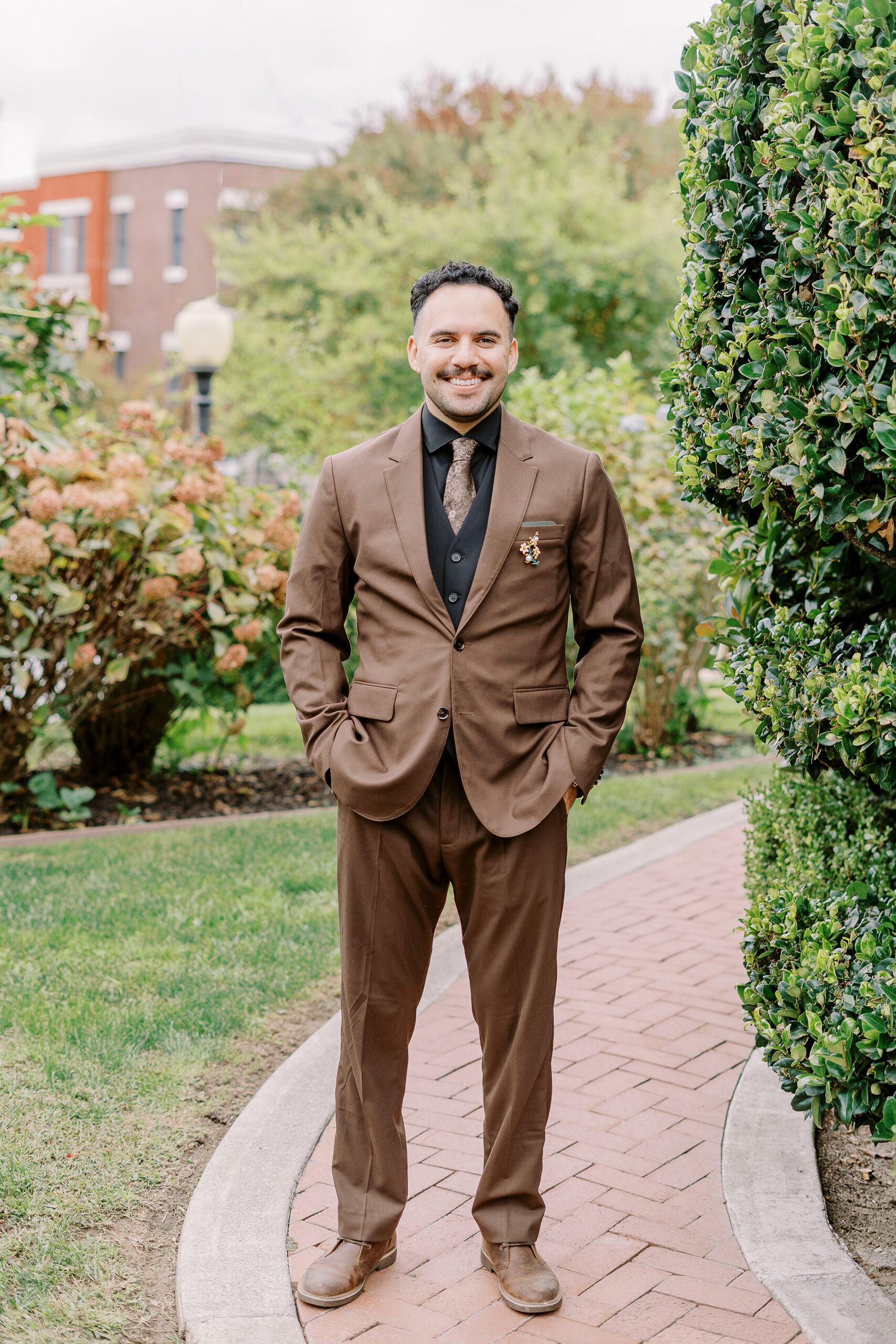 a groom poses for his portrait at Vizcaya photographed by Sacramento wedding photographers
