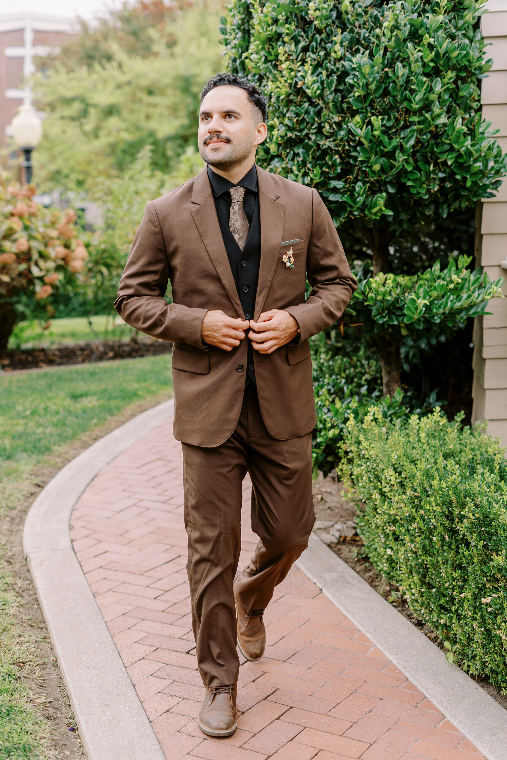 a groom poses for his portrait at Vizcaya photographed by Sacramento wedding photographers