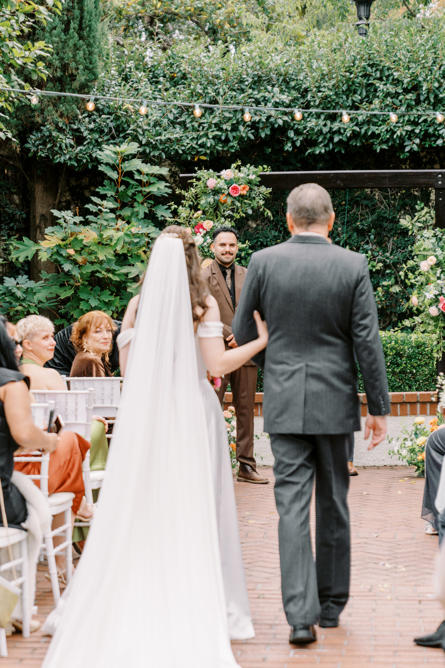 A bride and groom during their courtyard ceremony at Vizcaya photographed by Sacramento wedding photographers