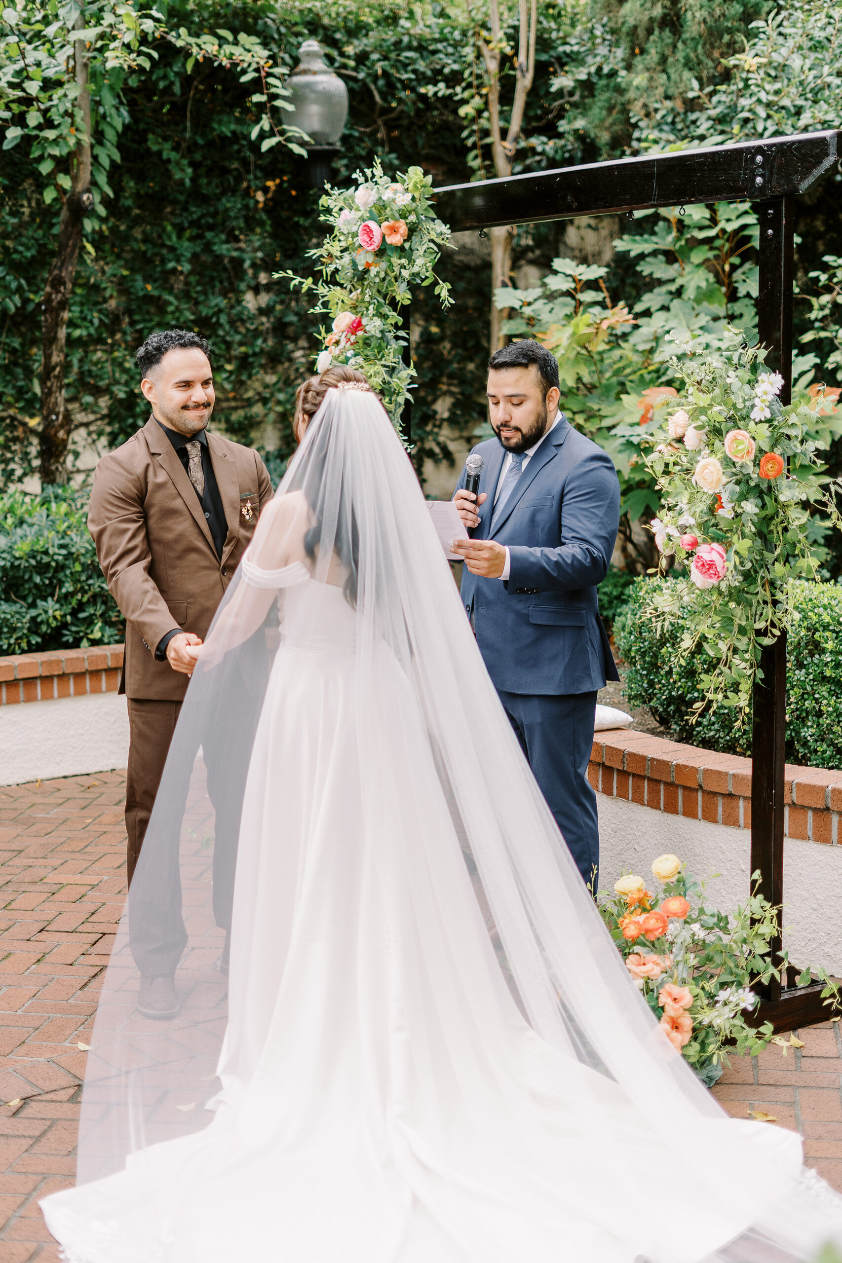 A bride and groom during their courtyard ceremony at Vizcaya photographed by Sacramento wedding photographers