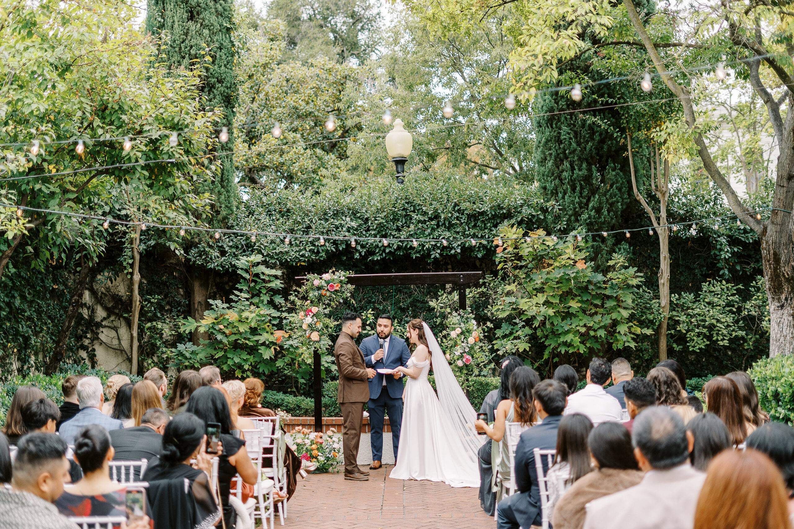 A bride and groom during their courtyard ceremony at Vizcaya photographed by Sacramento wedding photographers