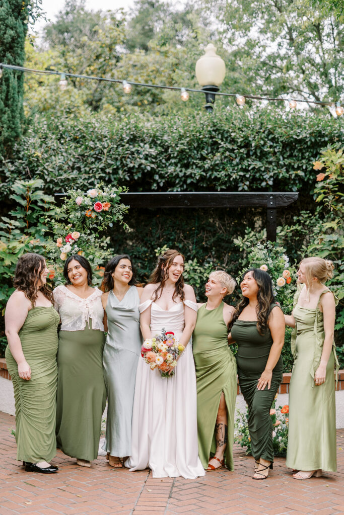 a bride laughs during portraits with her friends at Vizcaya photographed by Sacramento wedding photographers