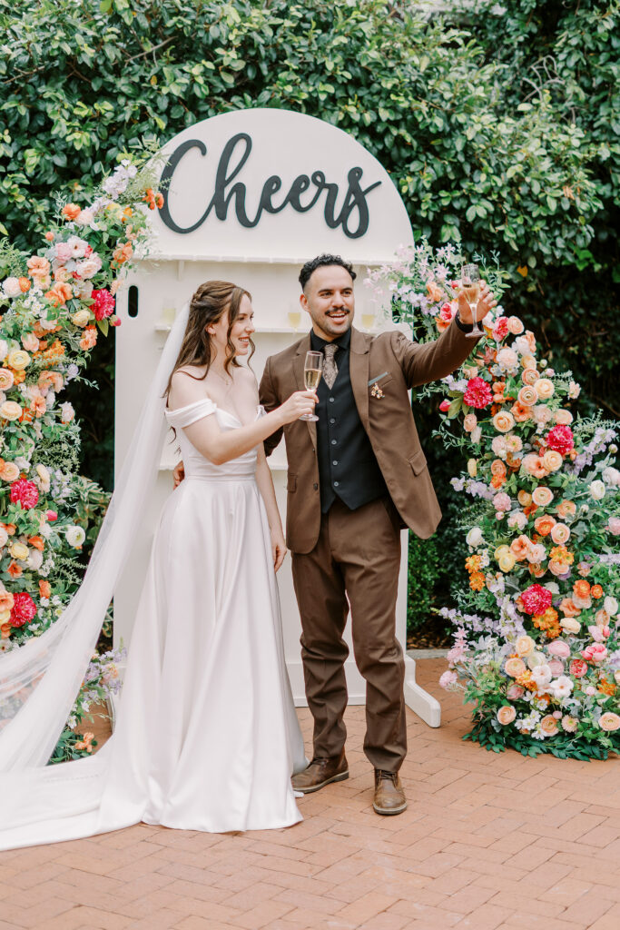 a bride and groom give a toast at Vizcaya photographed by Sacramento wedding photographers