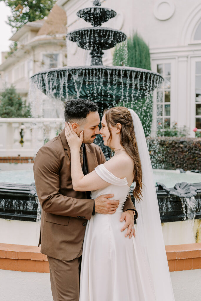 a bride and groom rest their foreheads together at Vizcaya photographed by Sacramento wedding photographers