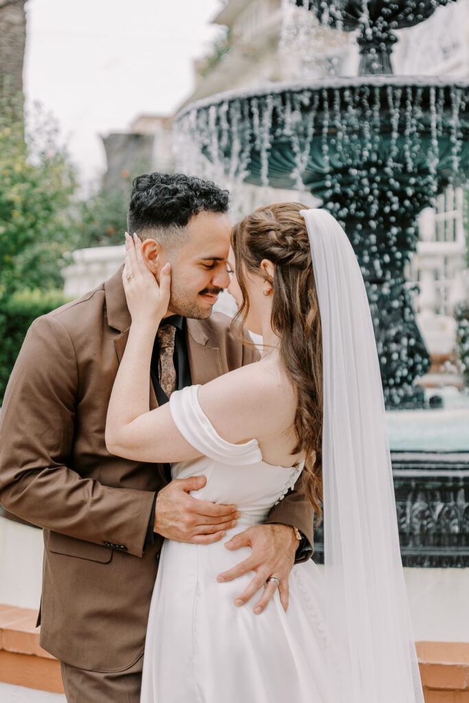 a bride and groom rest their foreheads together at Vizcaya photographed by Sacramento wedding photographers