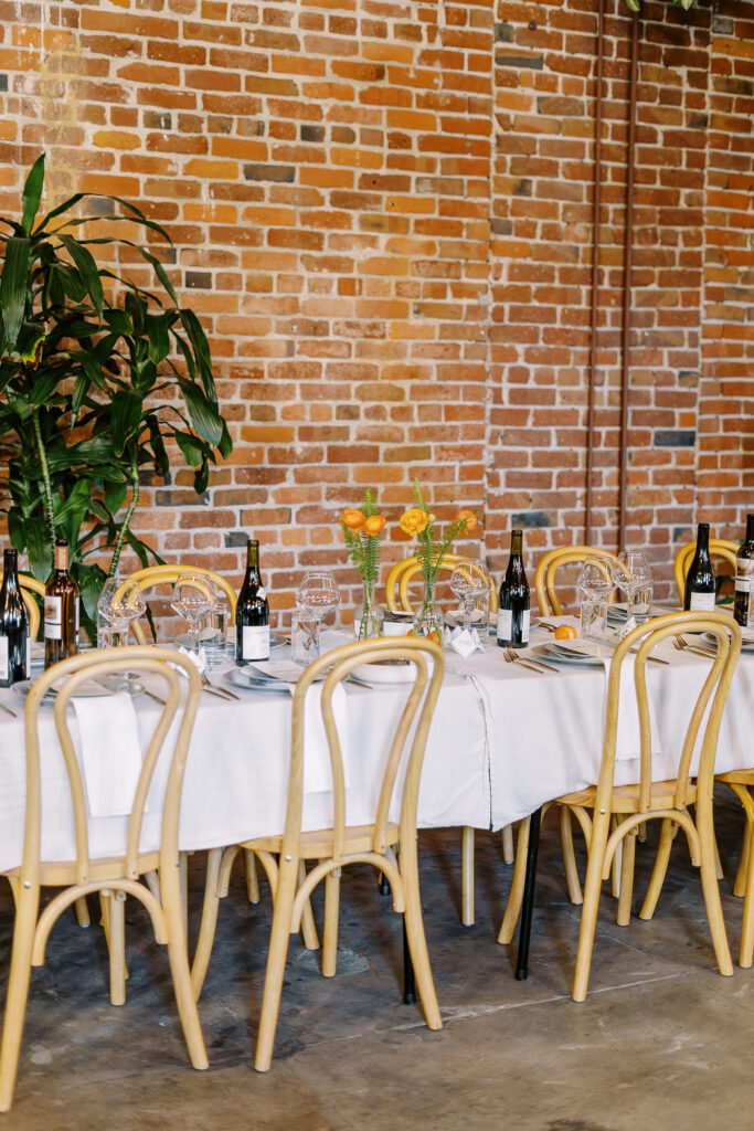 orange and plant themed wedding reception and ceremony decor at a midtown Sacramento wedding photographed by Sacramento wedding photographer
