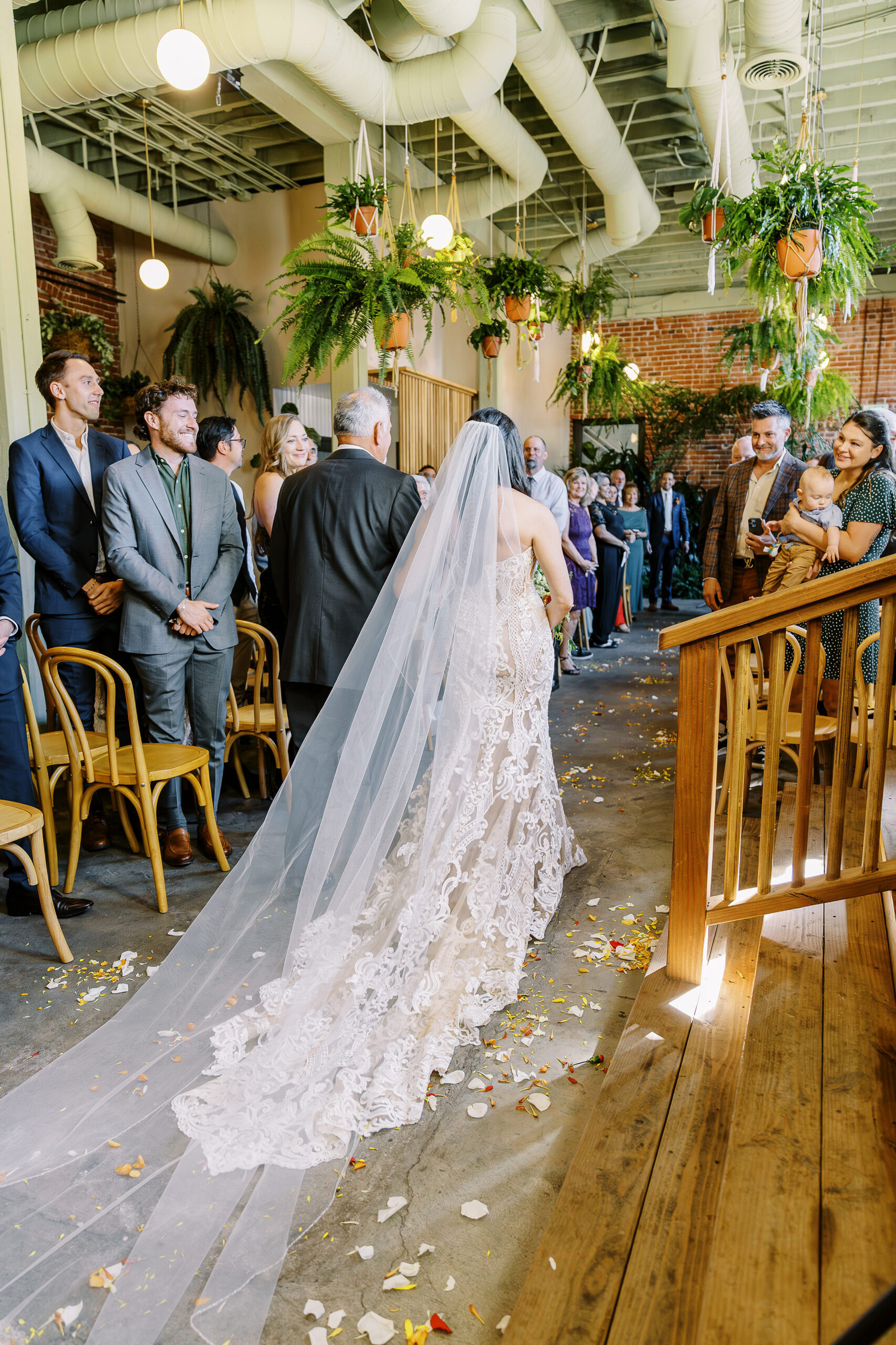a brides father walking her down the aisle at a midtown Sacramento wedding photographed by Sacramento wedding photographer