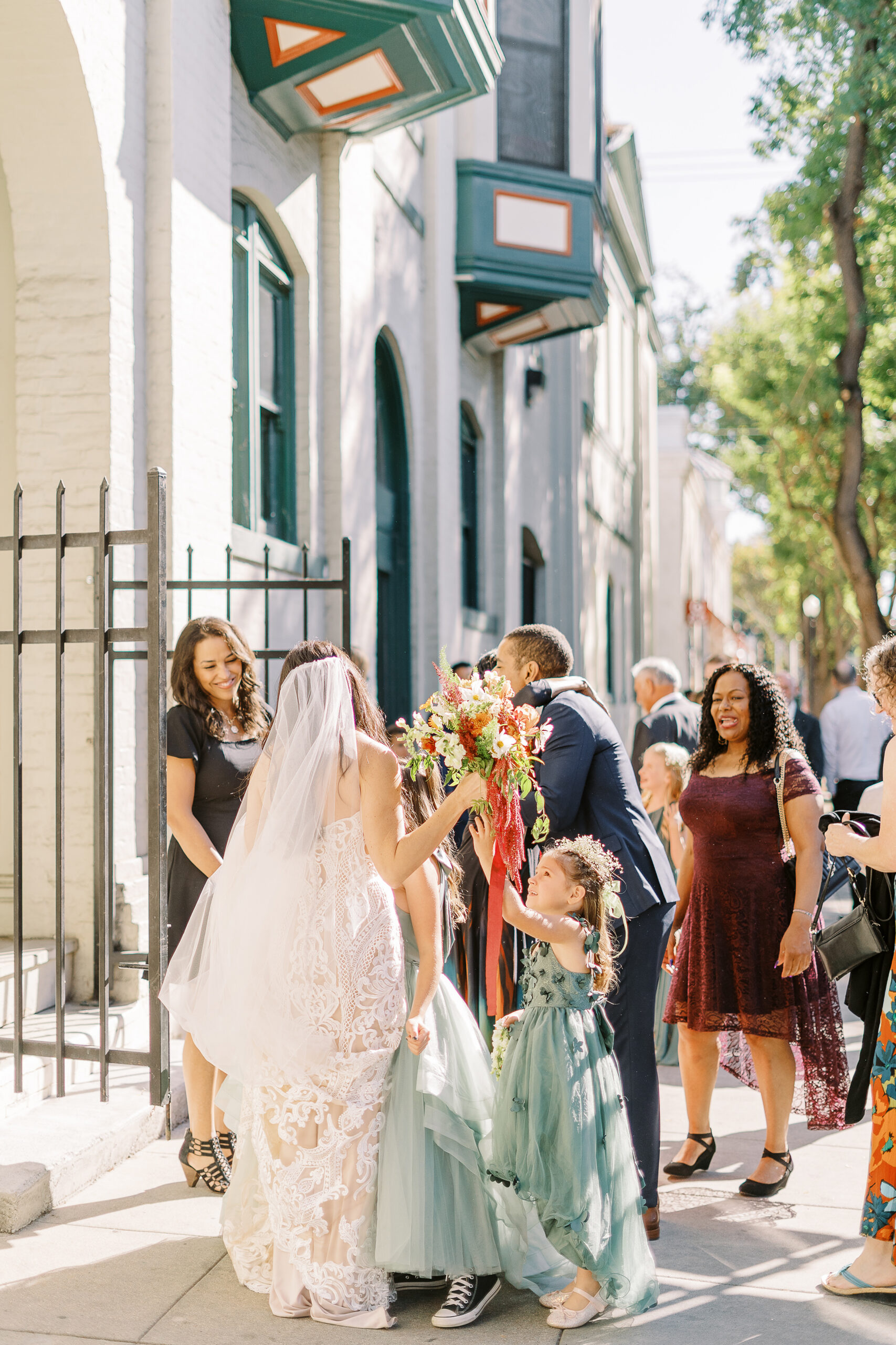 a bride and groom celebrate with their guests at their midtown Sacramento wedding ceremony photographed by Sacramento wedding photographer
