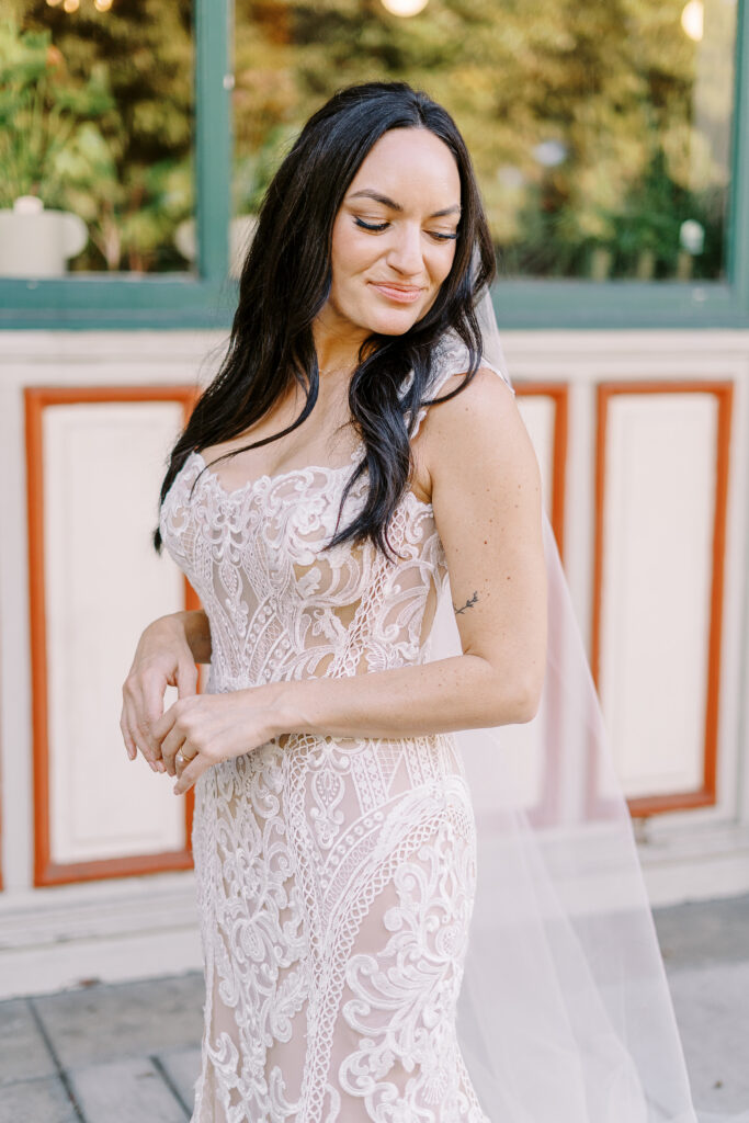 a bride poses for a portrait at her midtown Sacramento wedding photographed by Sacramento wedding photographer
