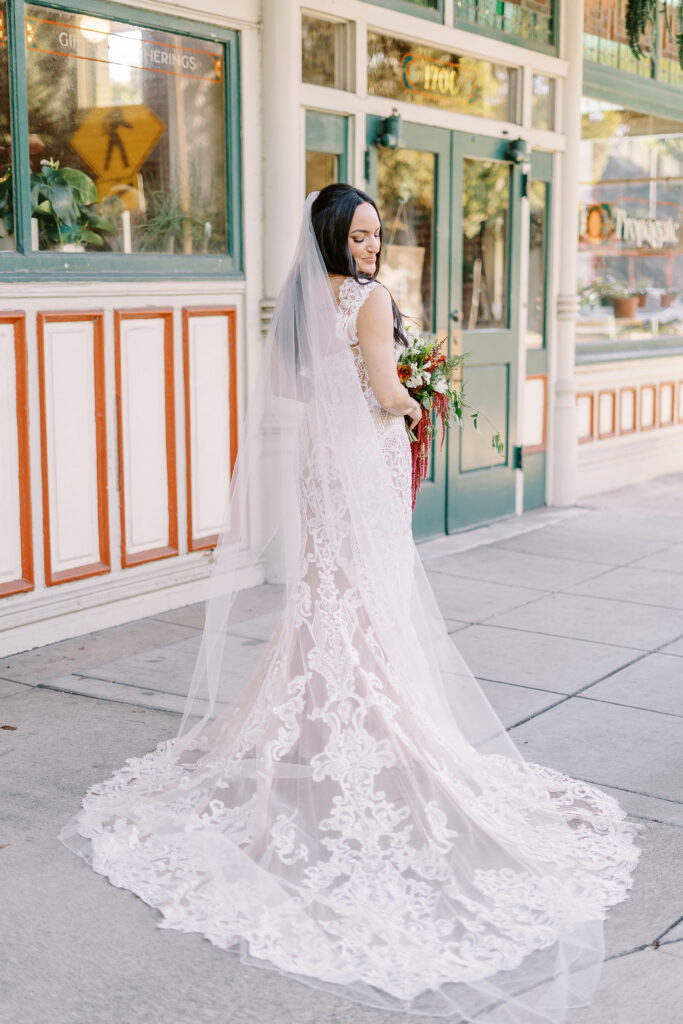 a bride poses for a portrait at her midtown Sacramento wedding photographed by Sacramento wedding photographer