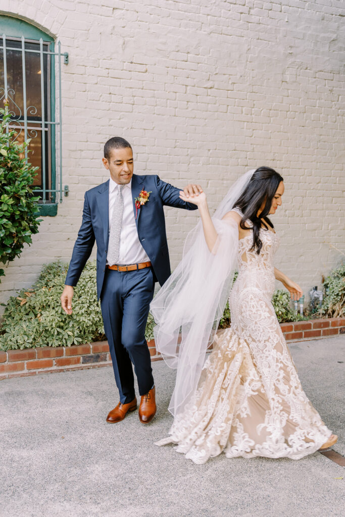 a bride and groom practice their first dance at their midtown Sacramento wedding photographed by Sacramento wedding photographer