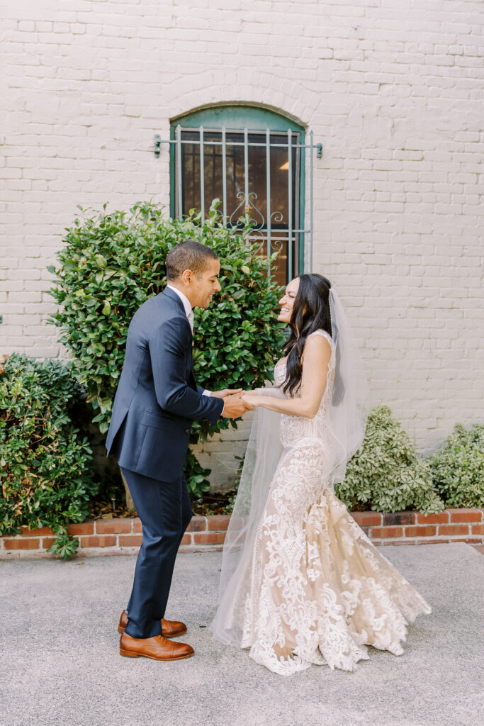 a bride and groom practice their first dance at their midtown Sacramento wedding photographed by Sacramento wedding photographer