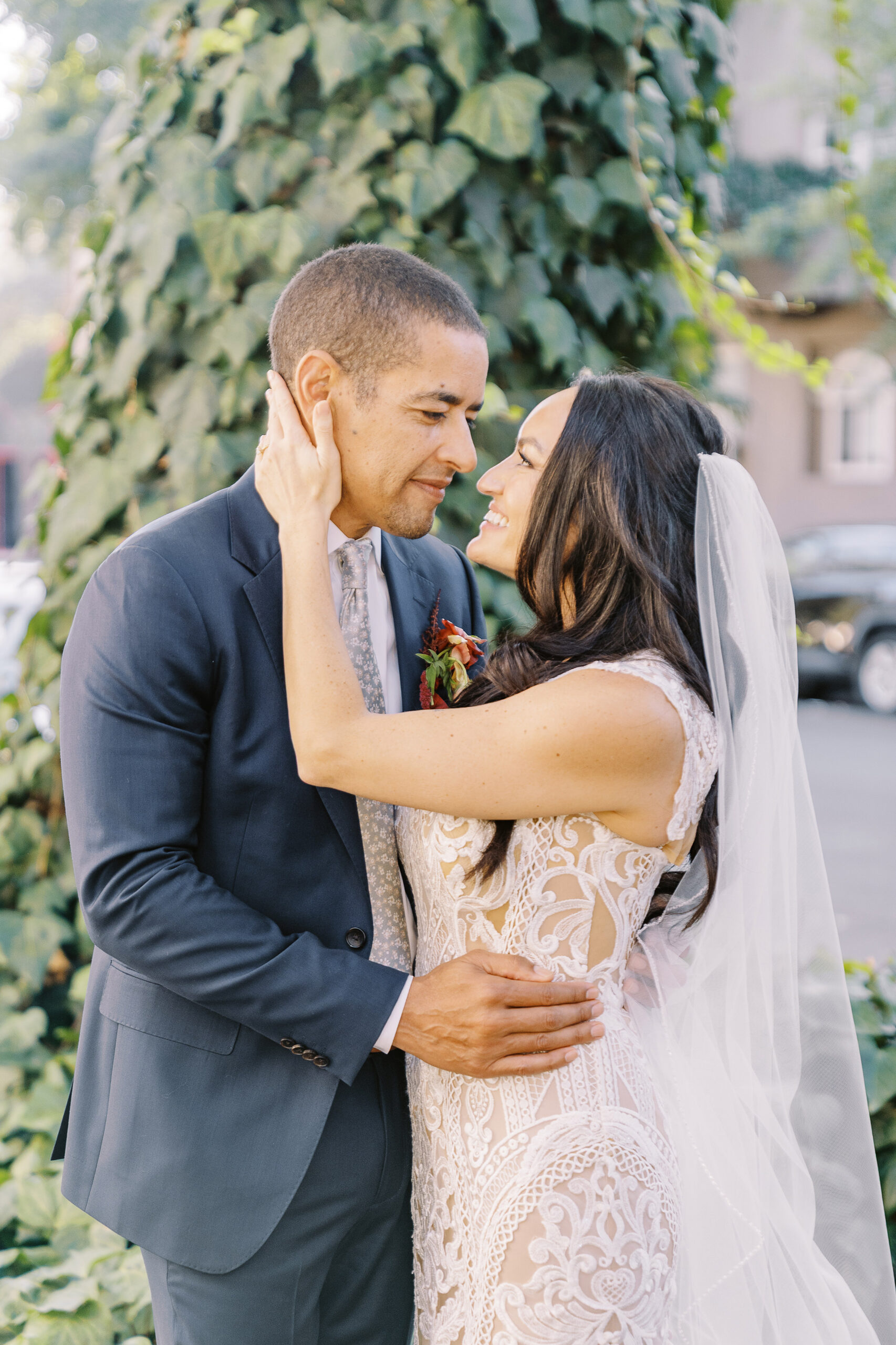 a bride and groom embrace each other for portraits at their midtown Sacramento wedding photographed by Sacramento wedding photographer