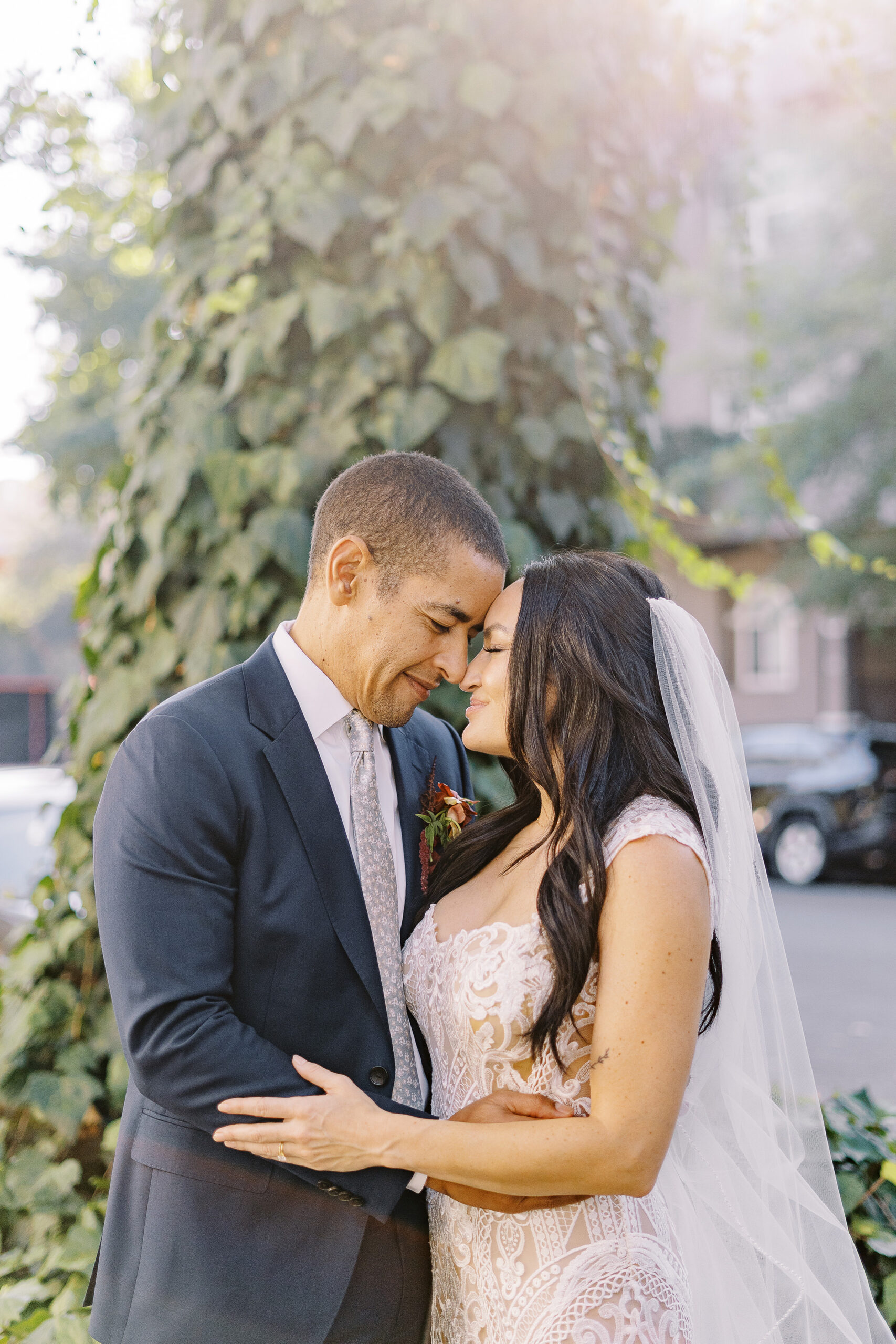 a bride and groom embrace each other for portraits at their midtown Sacramento wedding photographed by Sacramento wedding photographer