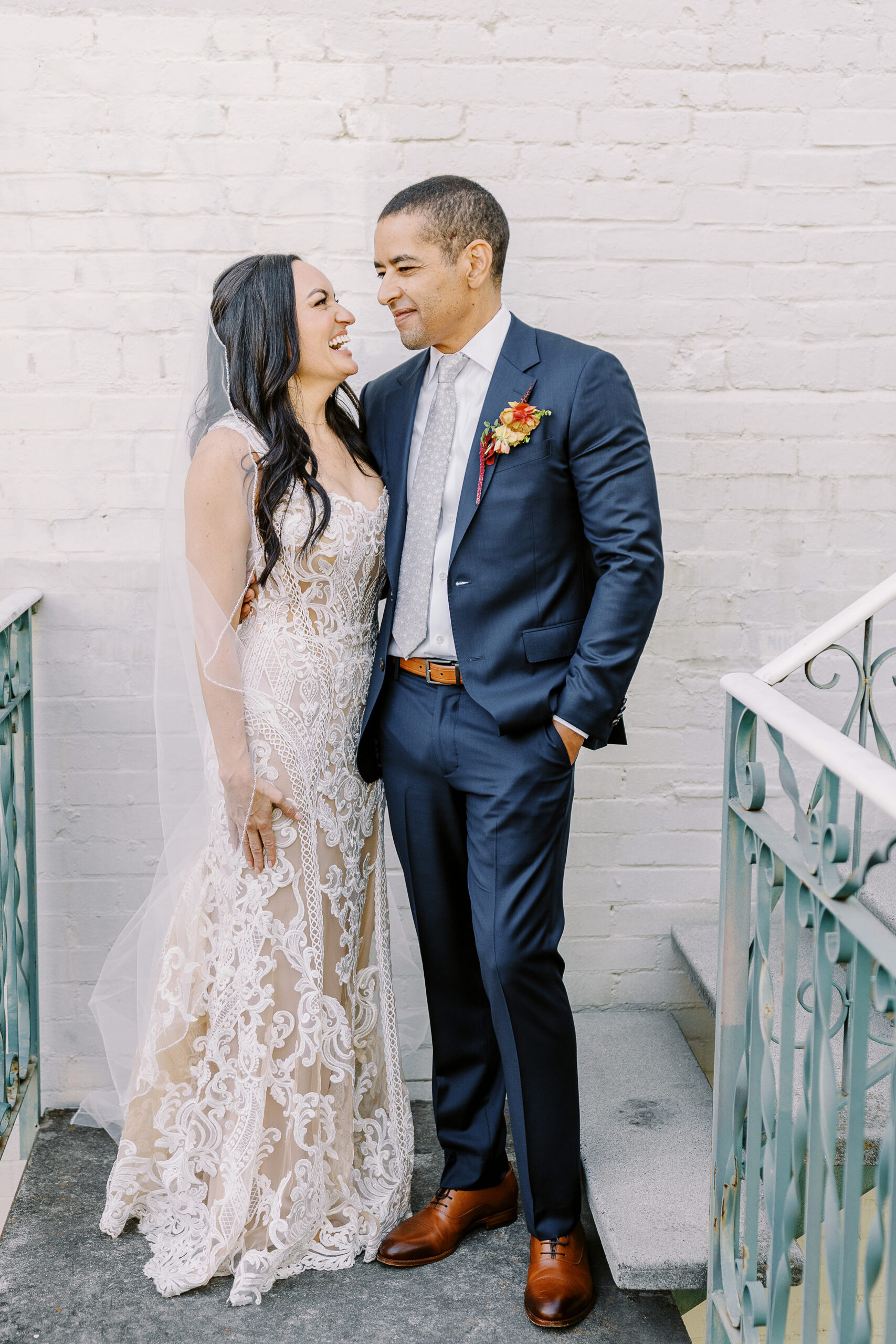 a bride and groom embrace each other for portraits at their midtown Sacramento wedding photographed by Sacramento wedding photographer