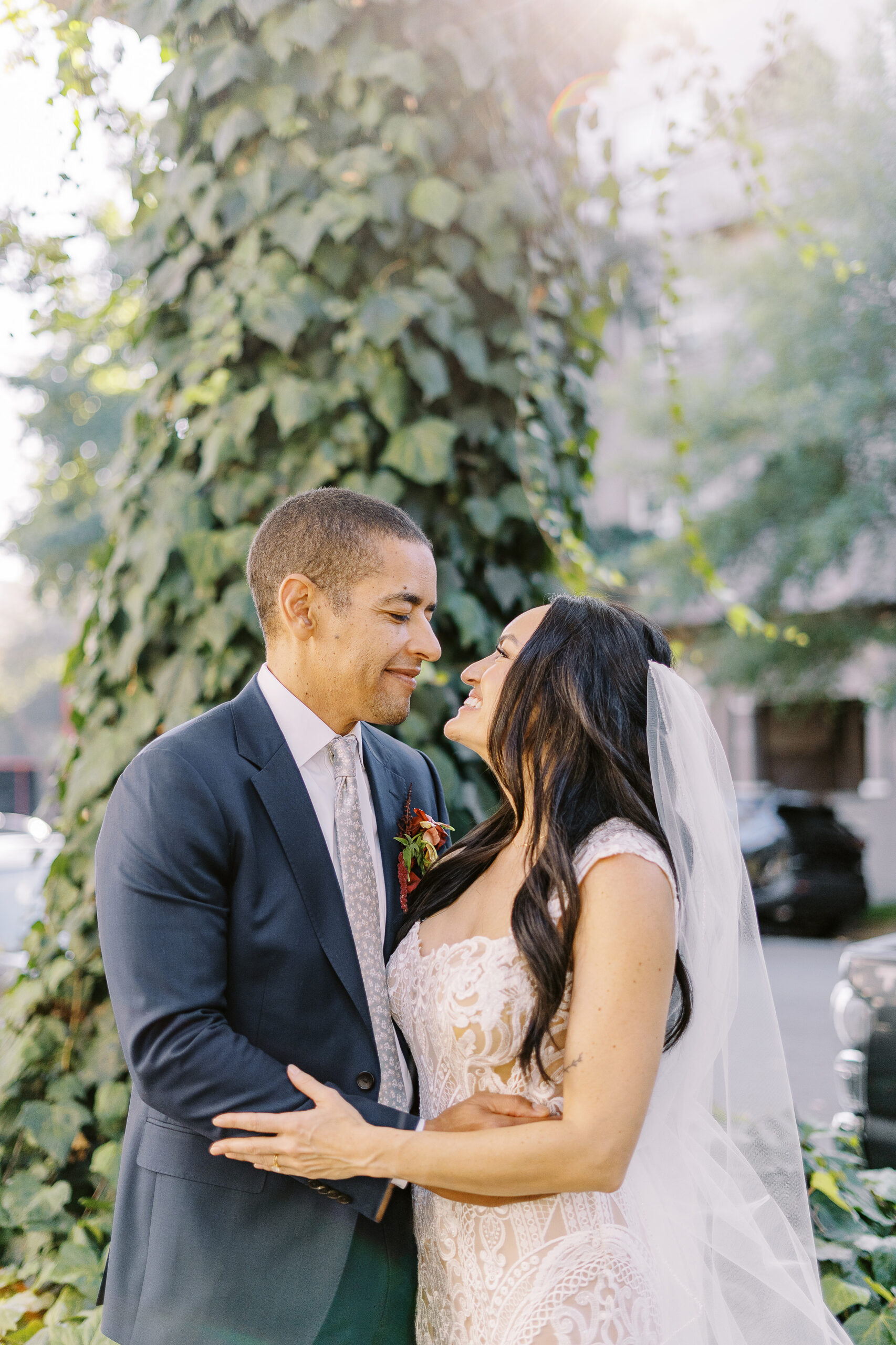 a bride and groom embrace each other for portraits at their midtown Sacramento wedding photographed by Sacramento wedding photographer